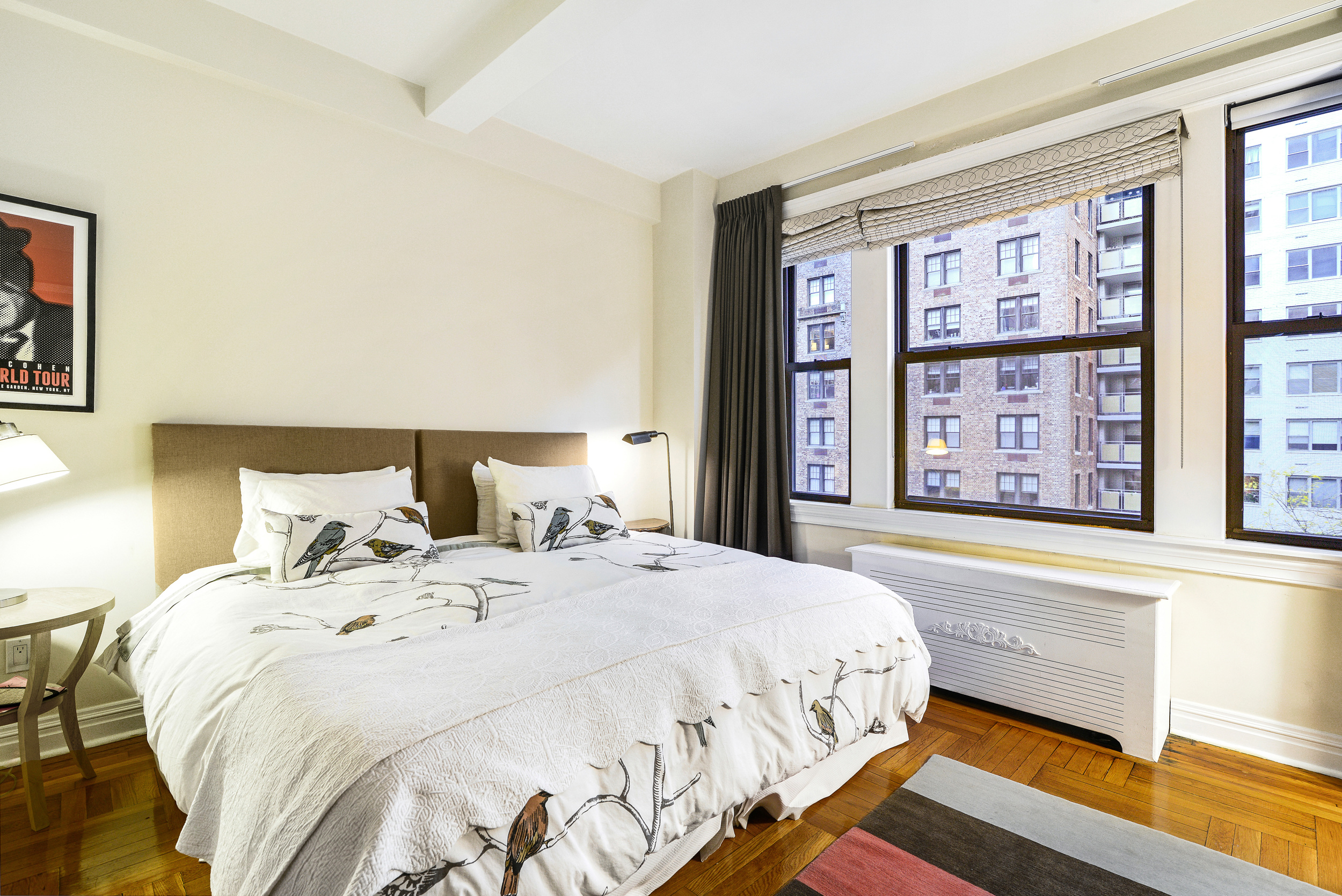 20 West 72nd Street, Unit 601 Manhattan, NY 10023 - Photo 15 of 21 a bedroom with a large bed and a window
