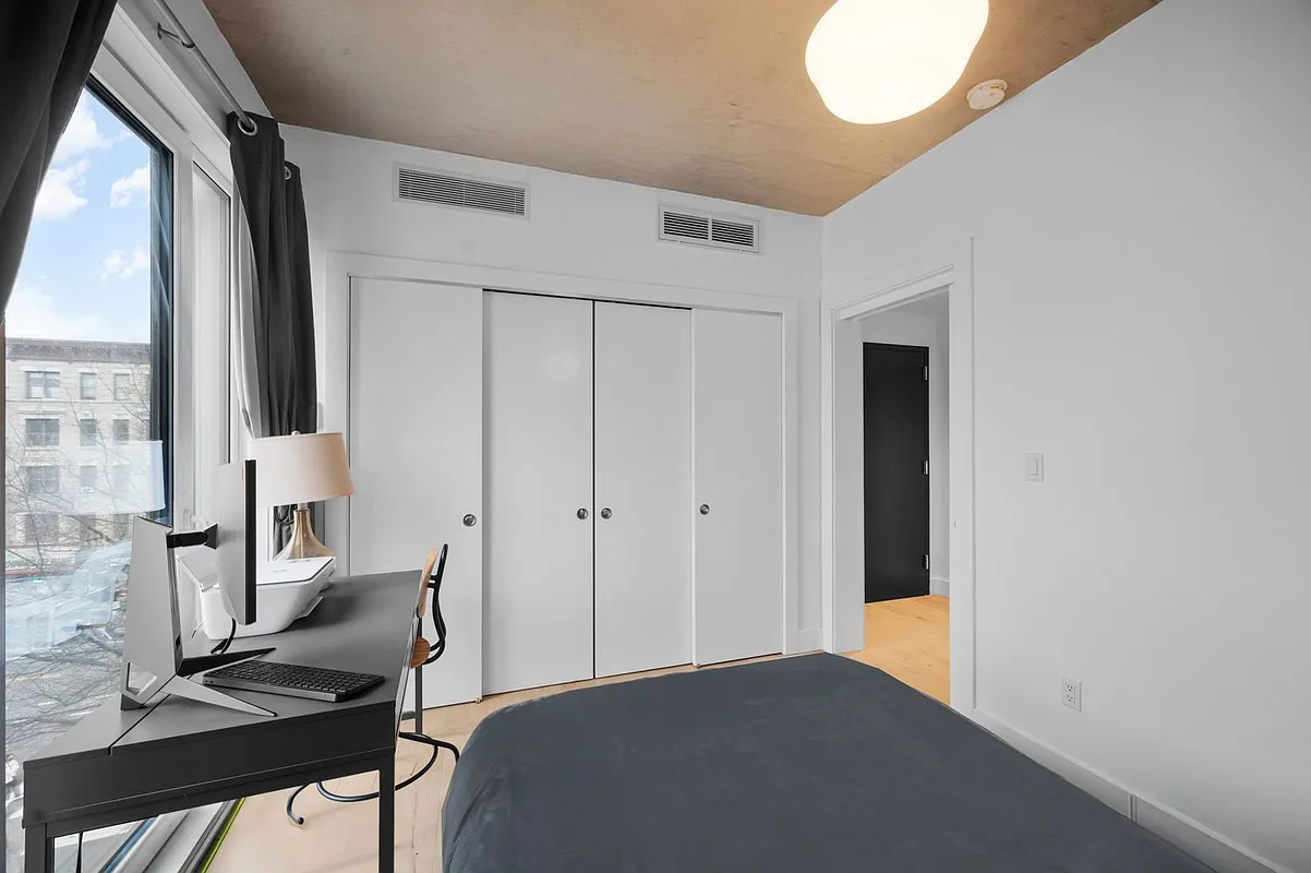 169 Huron Street, Unit 4A Brooklyn, NY 11222 - Photo 7 of 15 a workspace with furniture and a window