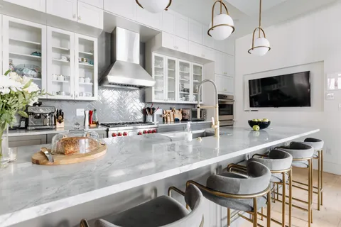 a kitchen with a table and chairs in it