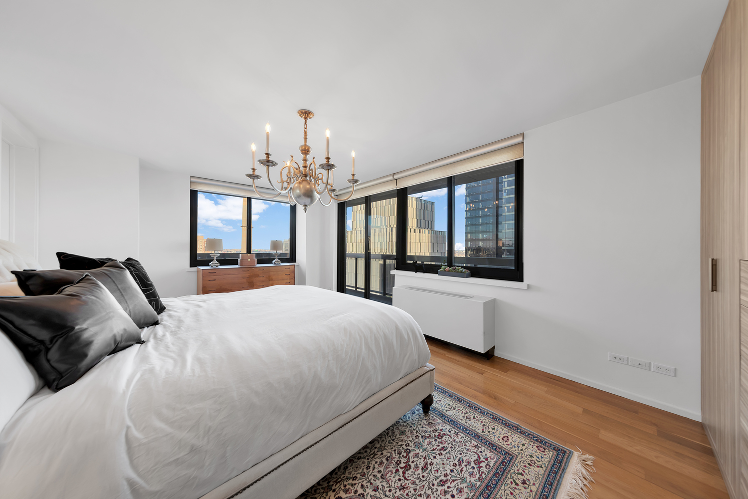 515 East 72nd Street, Unit 36B Manhattan, NY 10021 - Photo 8 of 36 a bedroom with a large bed and a window
