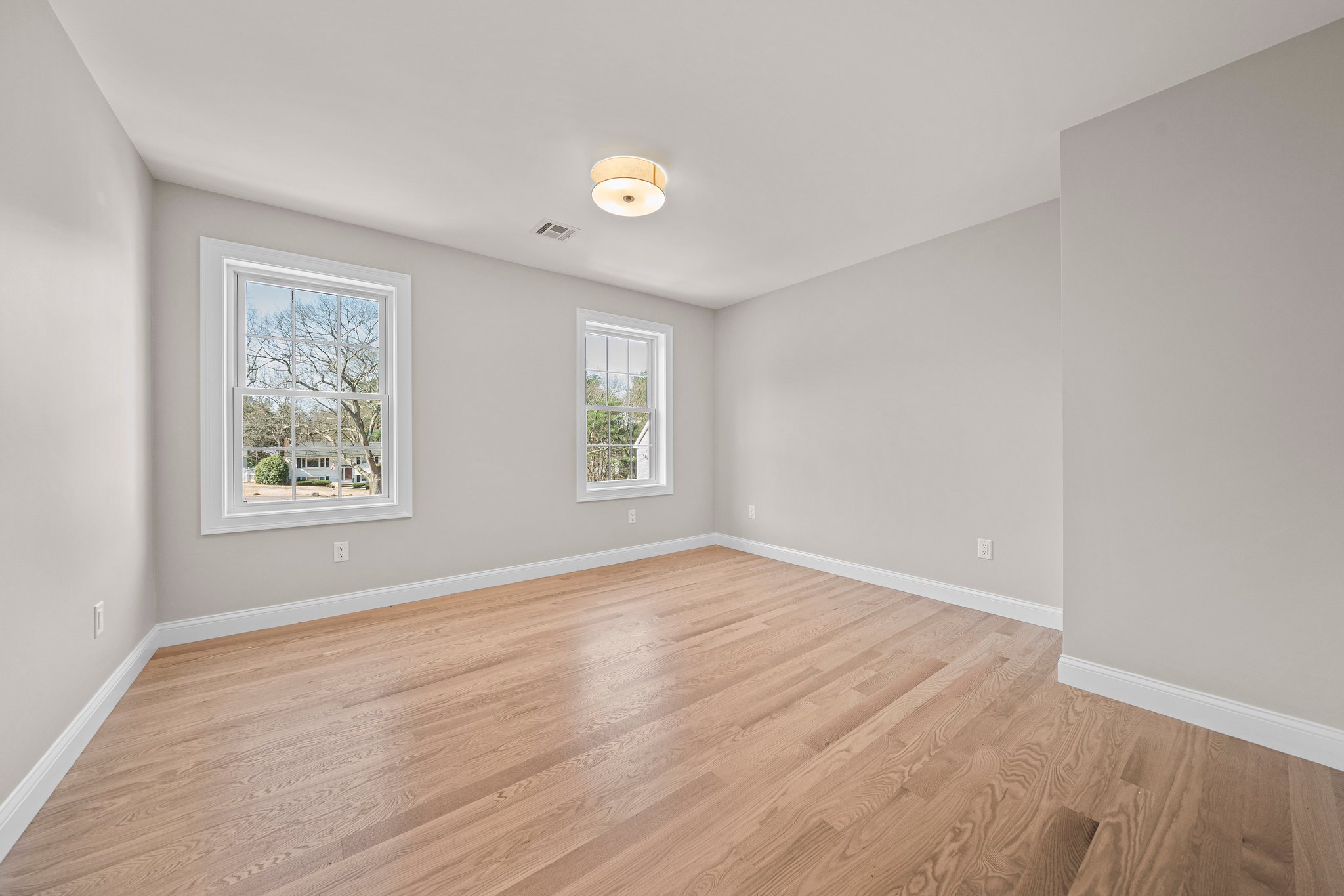 3 Everendon Road Canton, MA 02021 - Photo 24 of 35 an empty room with wooden floor and windows
