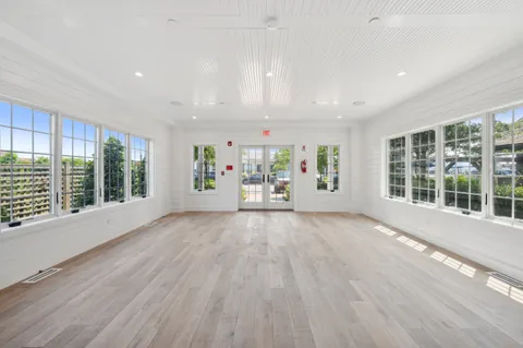 a bathroom with a sink a toilet and a window