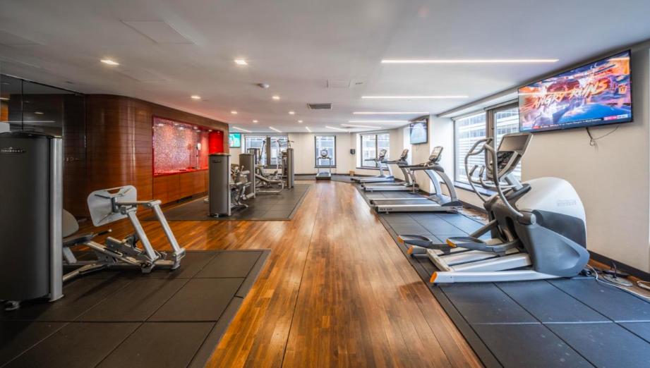 75 Wall Street, Unit 26D Manhattan, NY 10005 - Photo 5 of 11 a view of a room with gym equipment