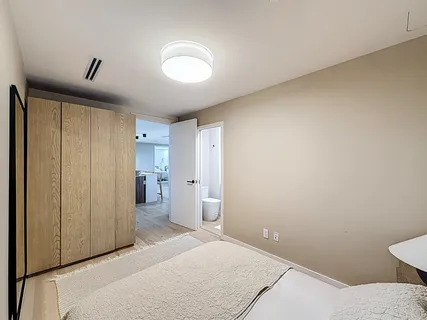 a view of a room with gym equipment and large windows