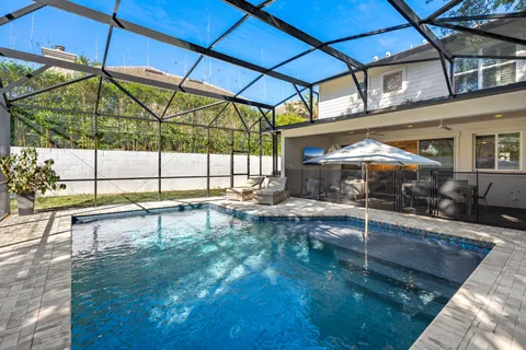 a view of a swimming pool with a patio