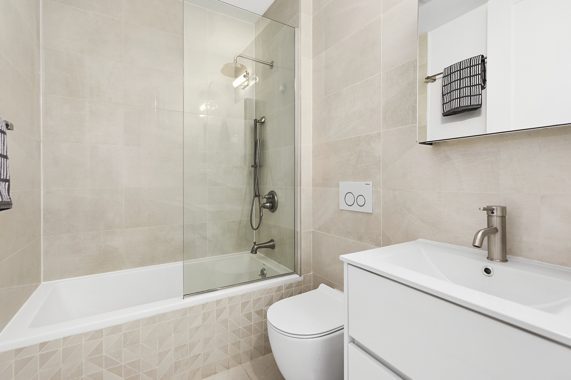 320 Humboldt Street, Unit 2 Brooklyn, NY 11211 - Photo 8 of 10 a bath room with a toilet sink and a bath tub