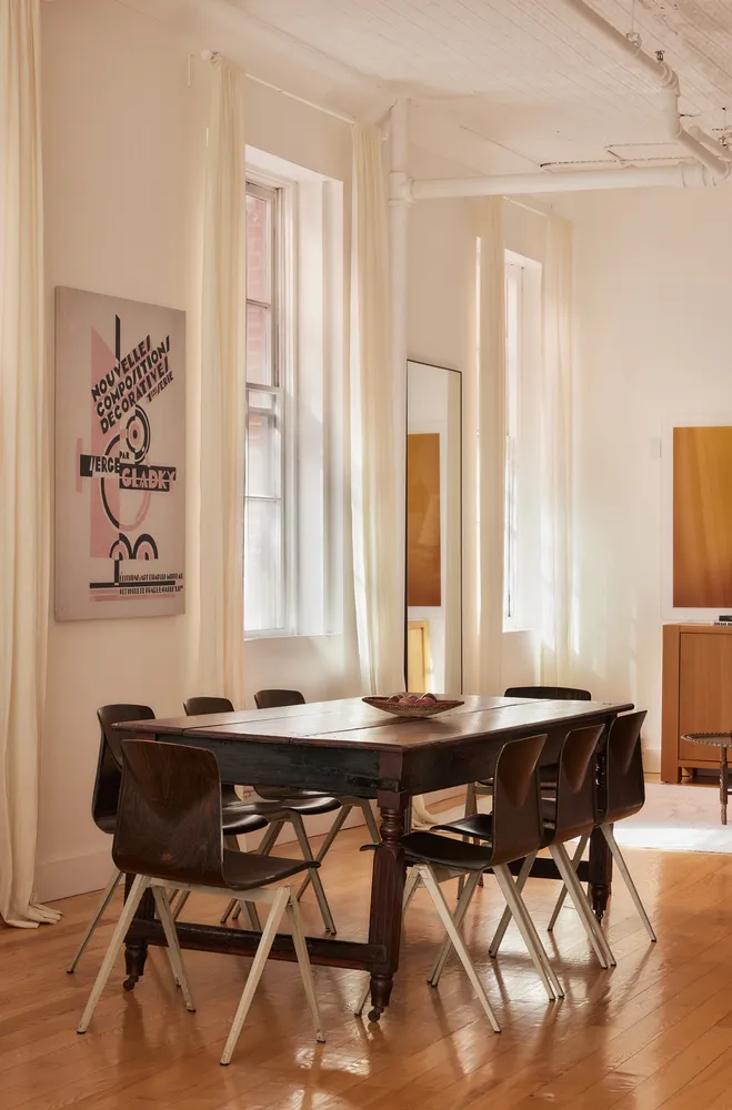 a room with a table and chairs in it