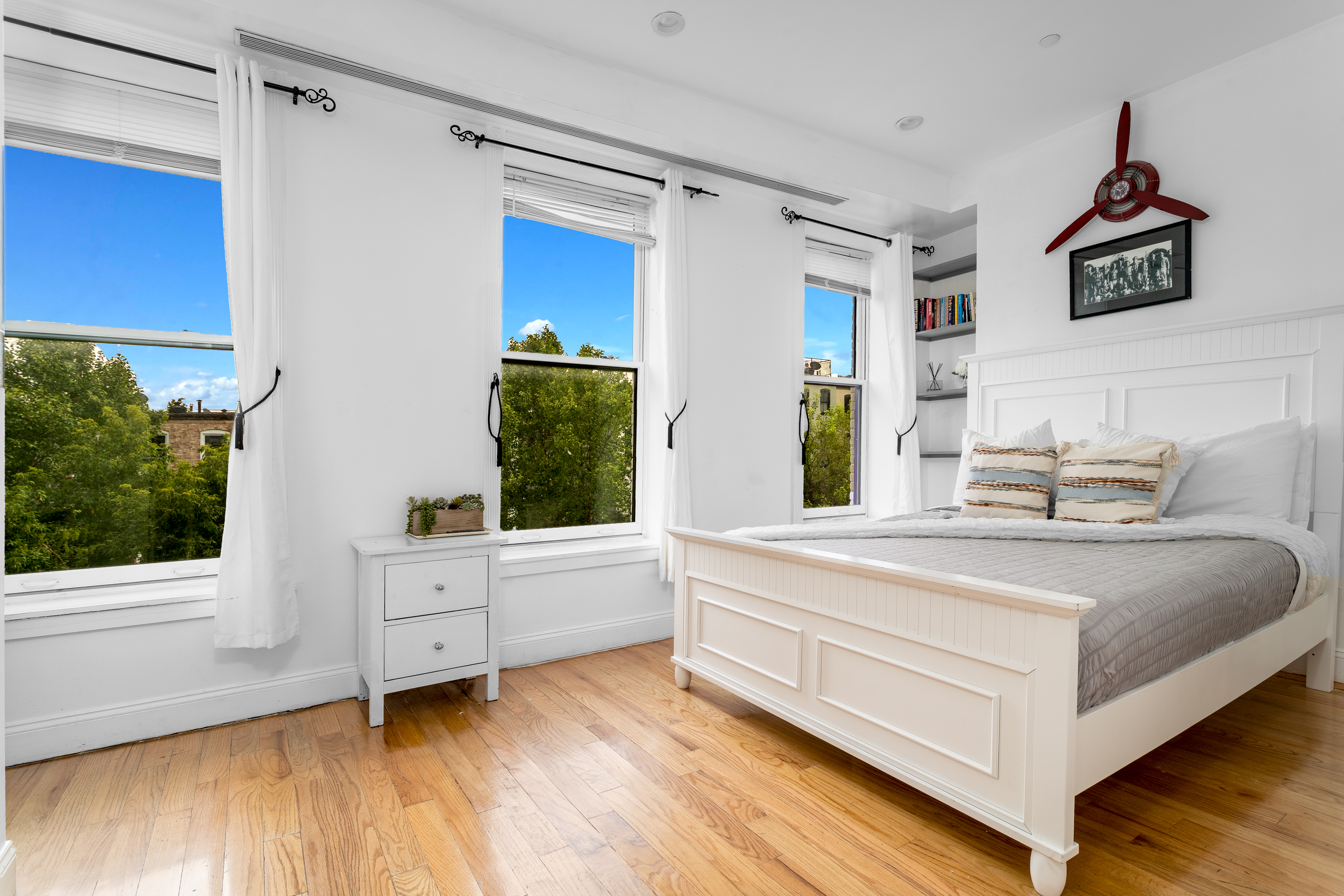616 MacDonough Street, Unit 2 Brooklyn, NY 11233 - Photo 7 of 12 a spacious bedroom with a bed and a window
