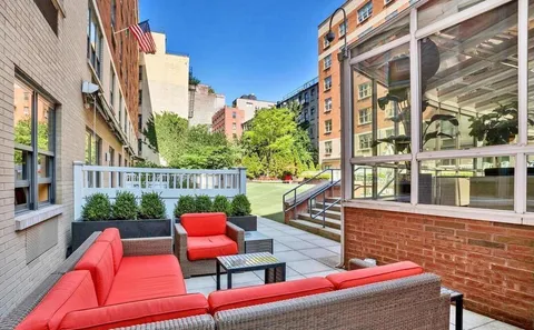 a outdoor space with patio the couches and a potted plant on a table