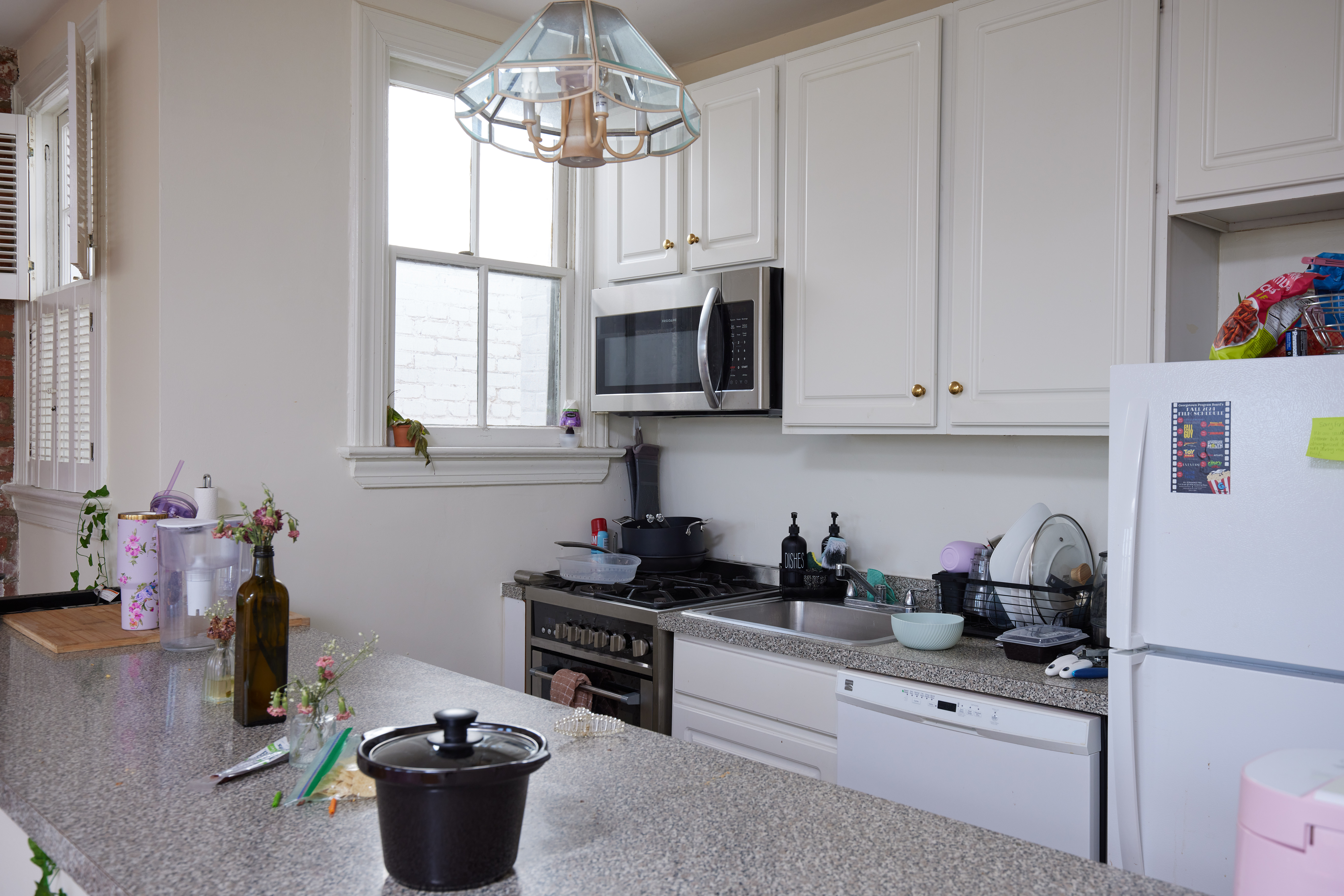 3420 R Street Northwest Washington, DC 20007 - Photo 34 of 53 a kitchen with a stove and a white cabinets