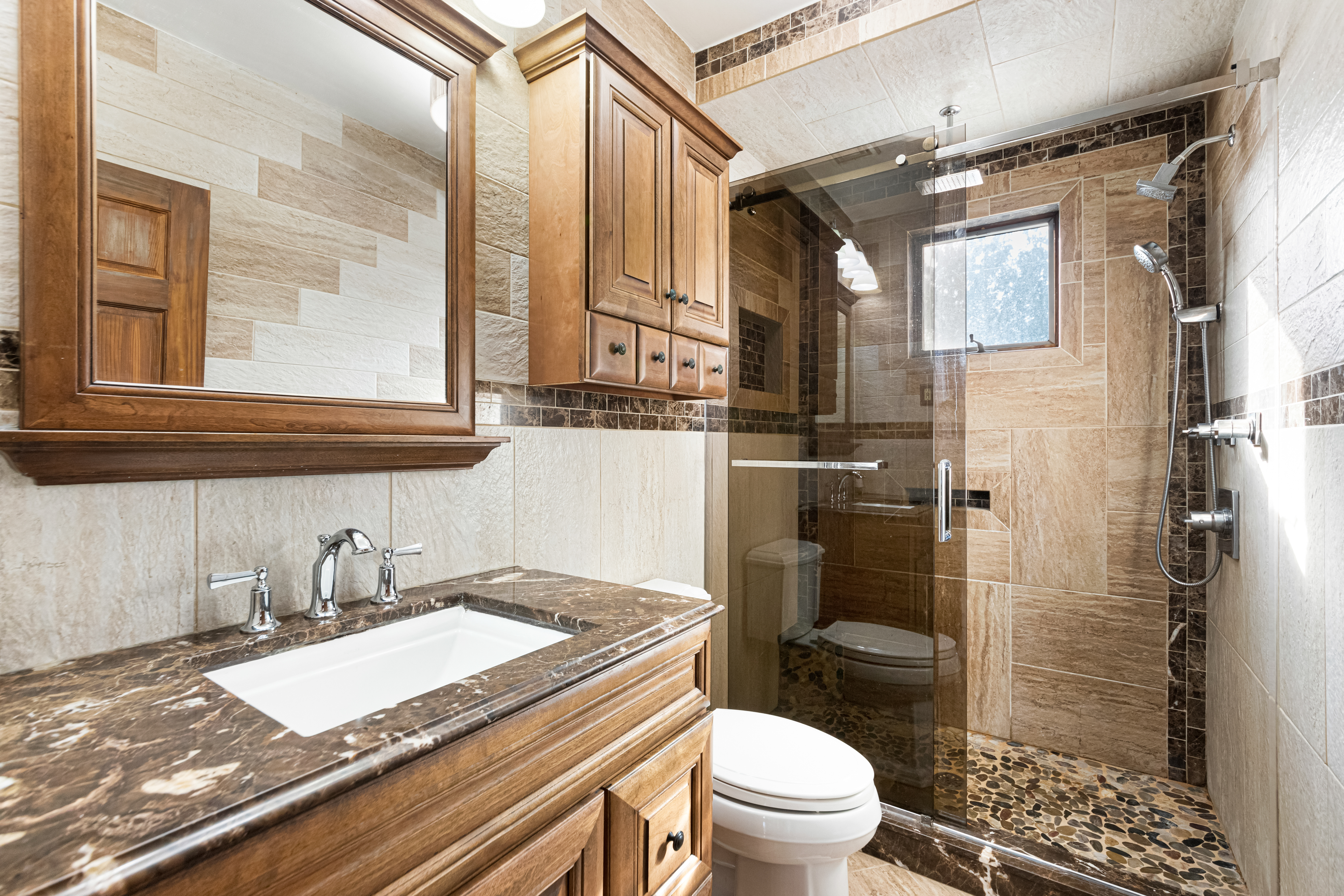1874 Ryder Street Brooklyn, NY 11234 - Photo 9 of 20 a bathroom with a granite countertop sink toilet and shower