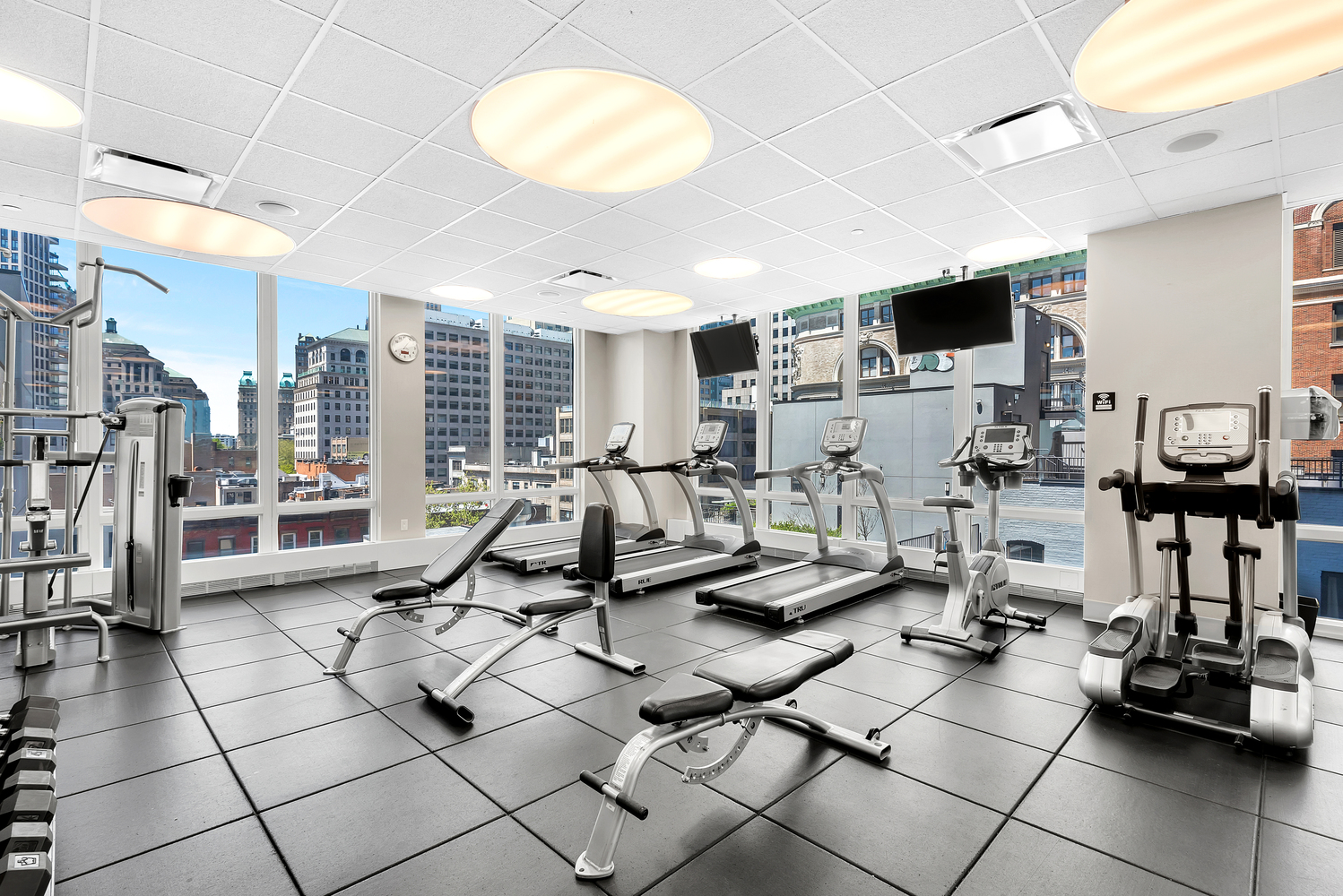 388 Bridge Street, Unit PH45AB Brooklyn, NY 11201 - Photo 26 of 36 a living room with lots of furniture and a flat screen tv