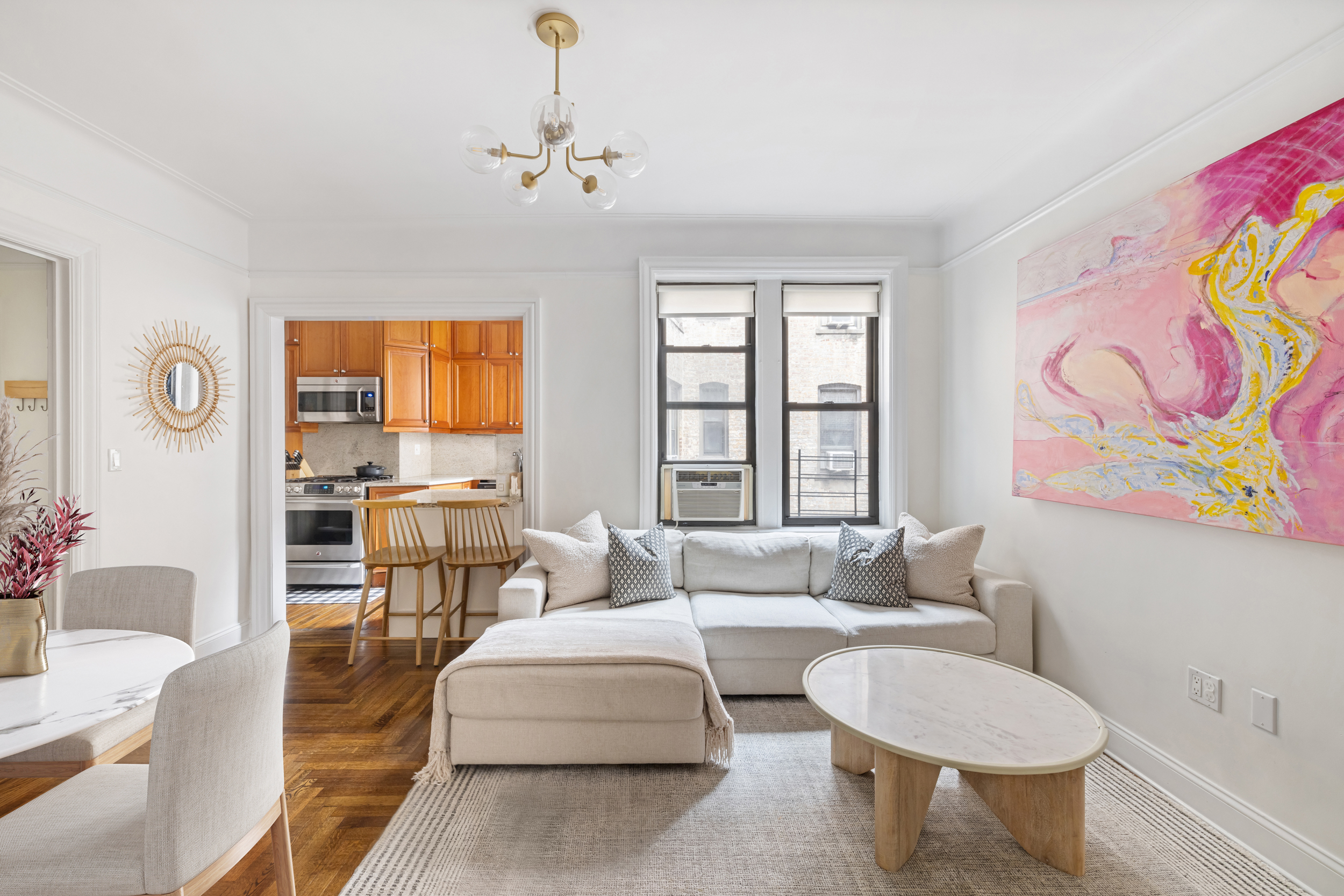 305 East 88th Street, Unit 4A Manhattan, NY 10128 - Photo 2 of 13 a living room with furniture and a large window