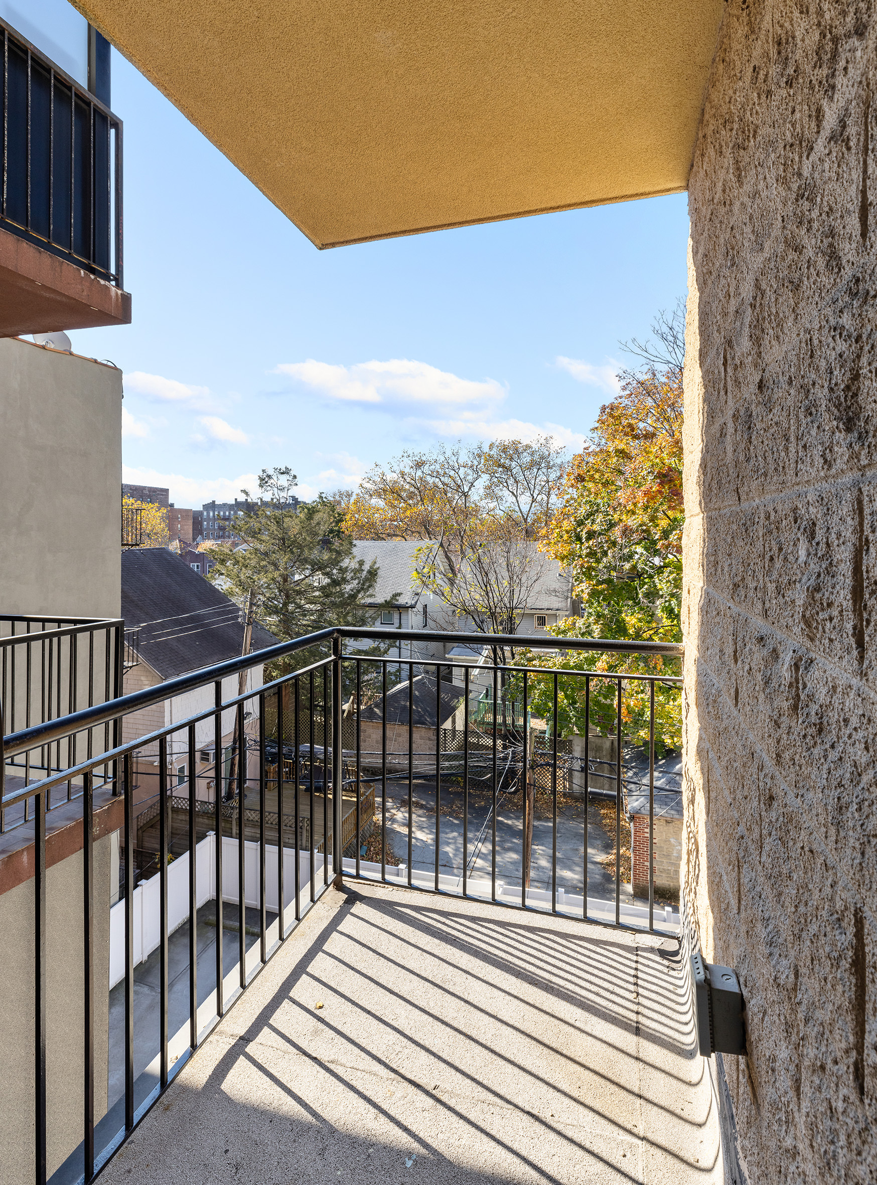 1972 Ocean Avenue, Unit 4A Brooklyn, NY 11230 - Photo 17 of 18 a view of a balcony with wooden floor