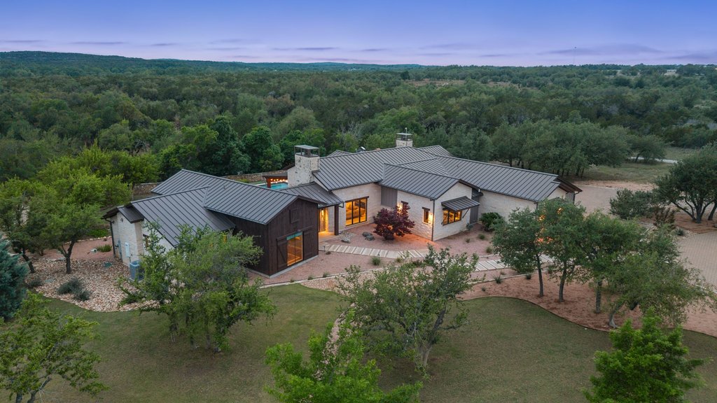 2560 Bell Springs Road Dripping Springs, TX 78620 - Photo 22 of 42 an aerial view of a house with garden space and a lake view