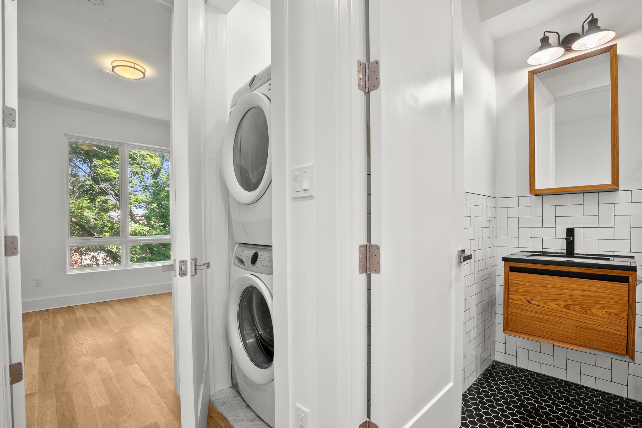 1130 Decatur Street Brooklyn, NY 11207 - Photo 6 of 24 a bathroom with a sink a mirror and a shower