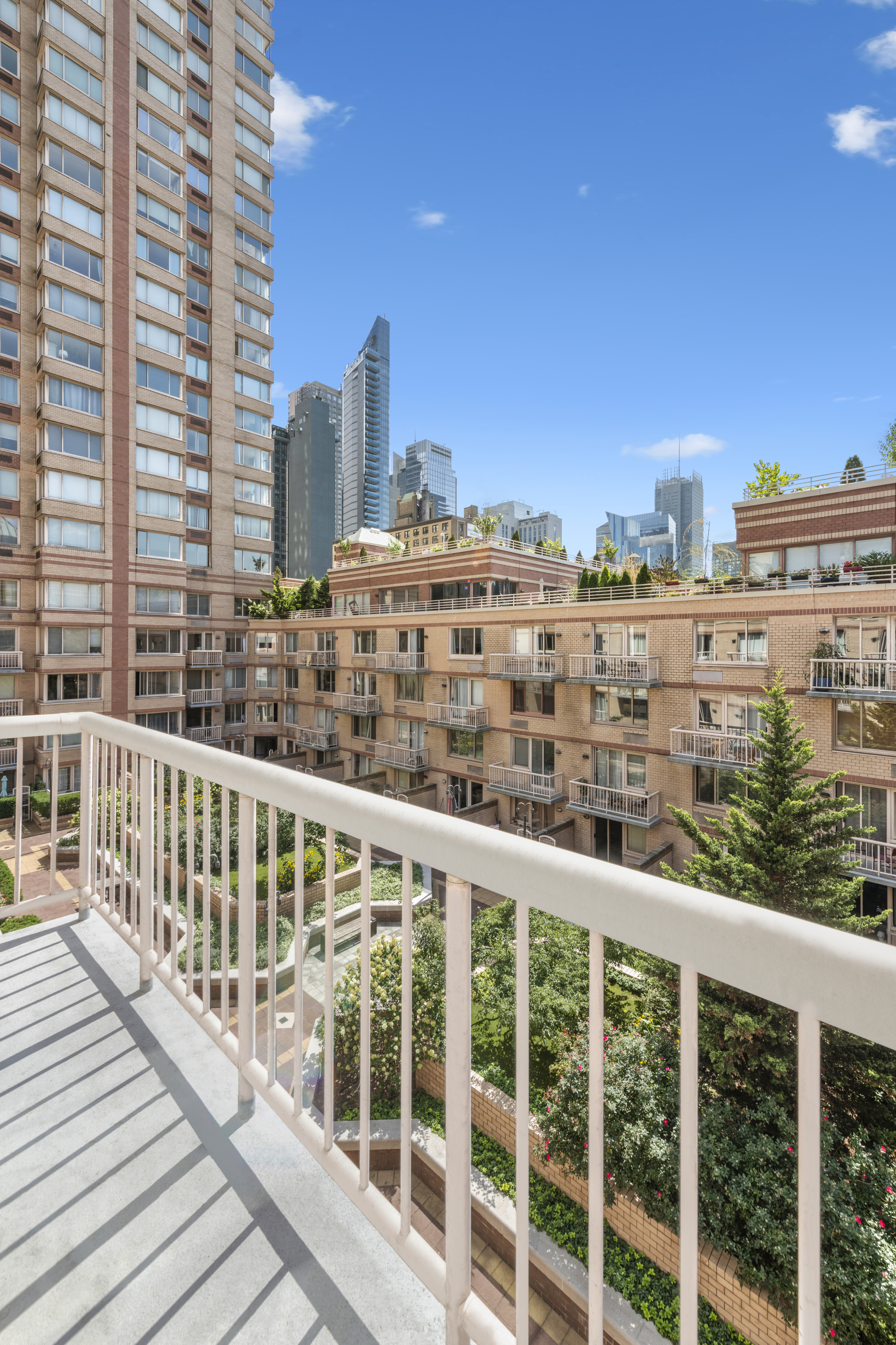393 West 49th Street, Unit 5NN Manhattan, NY 10019 - Photo 4 of 13 a view of a building from a balcony