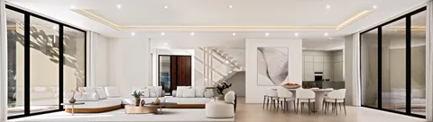 a room with lots of white furniture and a large window