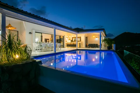 a view of swimming pool with a chair and tables