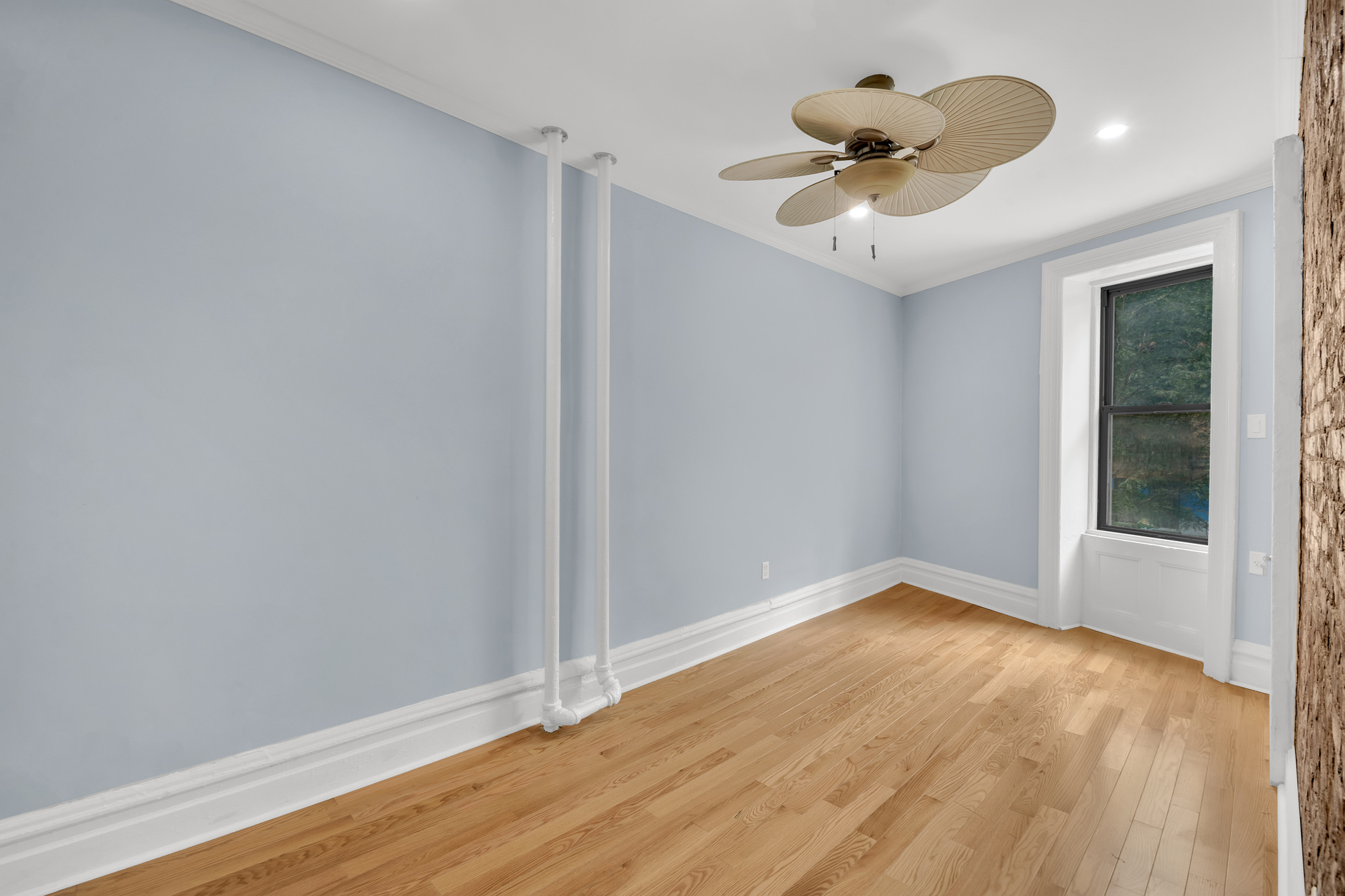 100 Hamilton Place, Unit 2F Manhattan, NY 10031 - Photo 12 of 21 wooden floor in an empty room