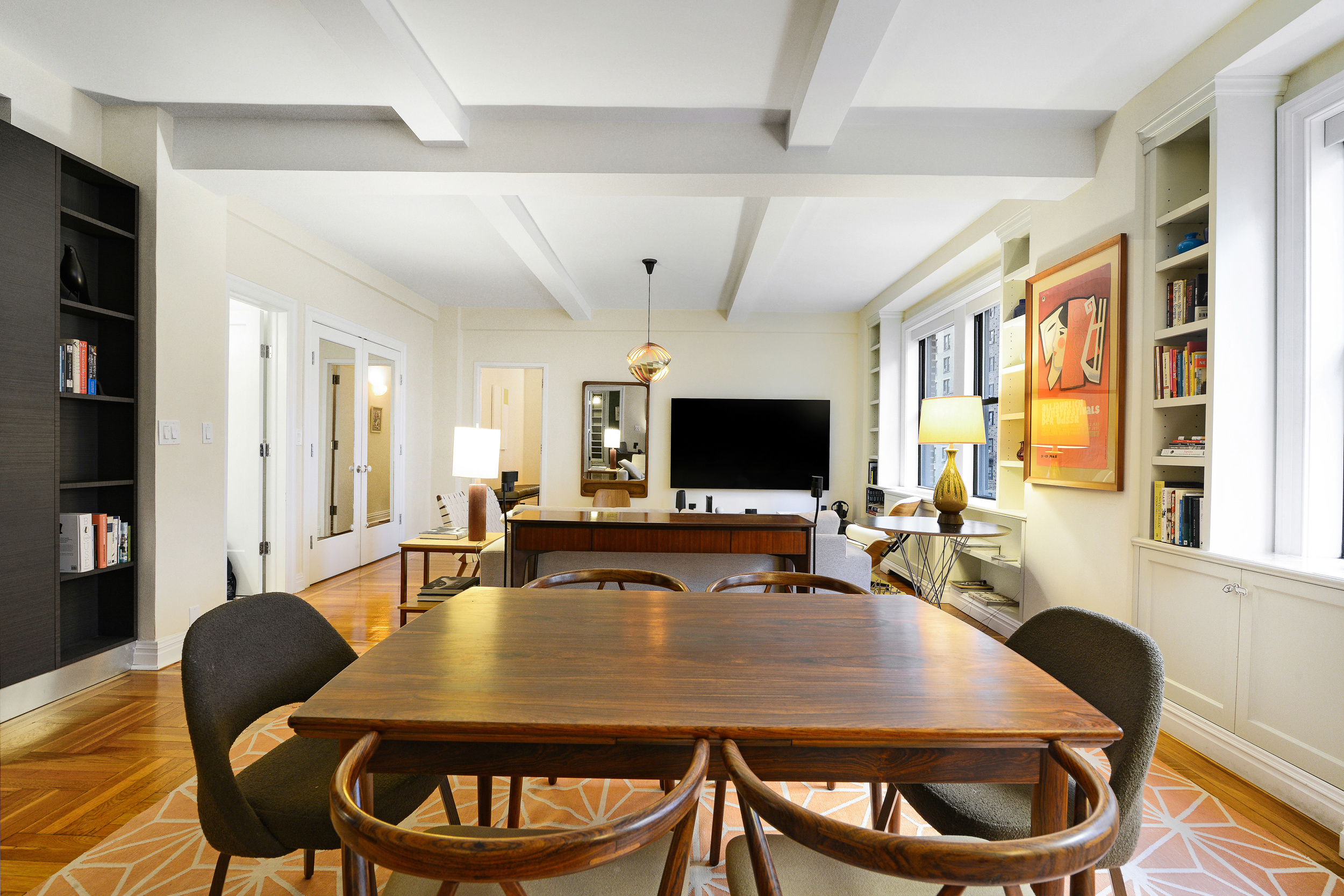 20 West 72nd Street, Unit 601 Manhattan, NY 10023 - Photo 7 of 21 a dining room with furniture a rug and wooden floor