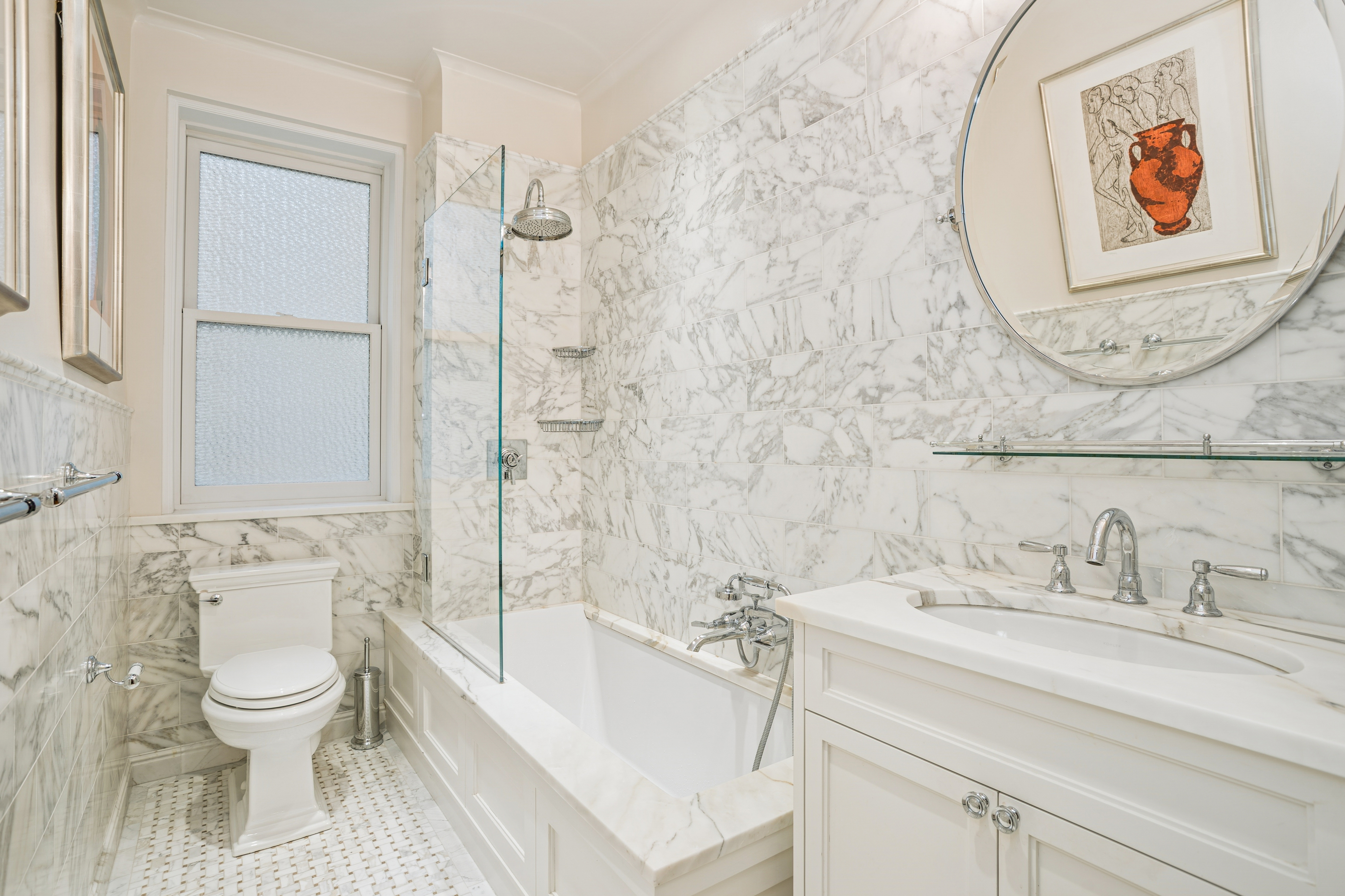 14 Sutton Place South, Unit 7G Manhattan, NY 10022 - Photo 6 of 9 a bathroom with a toilet sink and mirror