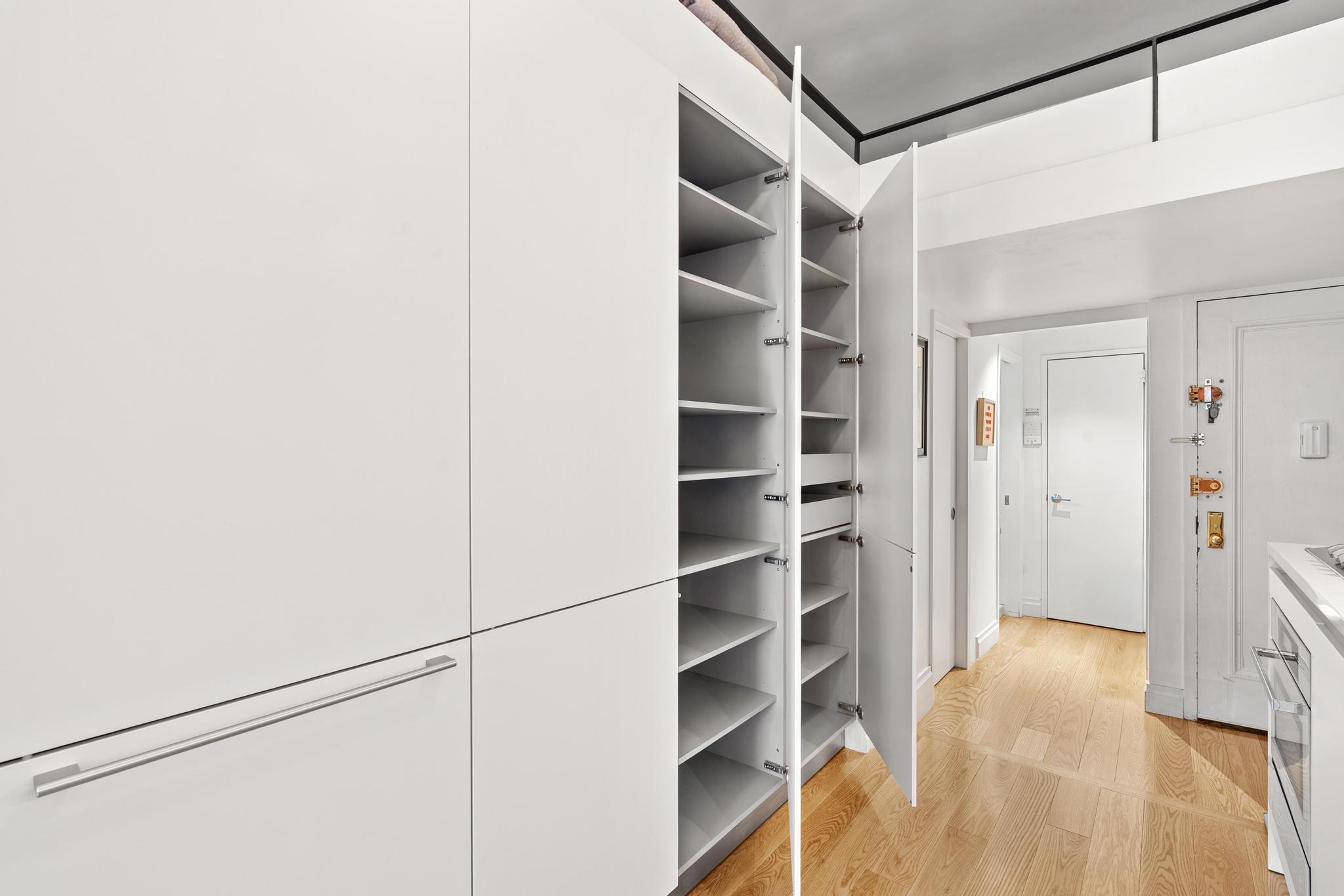 143 Sullivan Street, Unit 16 Manhattan, NY 10012 - Photo 10 of 10 a view of walk in closet with empty racks