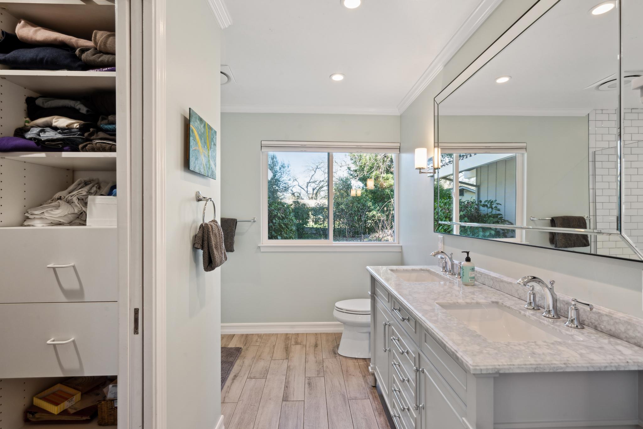 123 Frey Road Santa Rosa, CA 95409 - Photo 39 of 62 a bathroom with a granite countertop sink and a large mirror