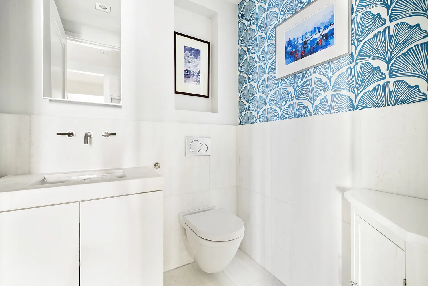 a bathroom with a toilet and a sink