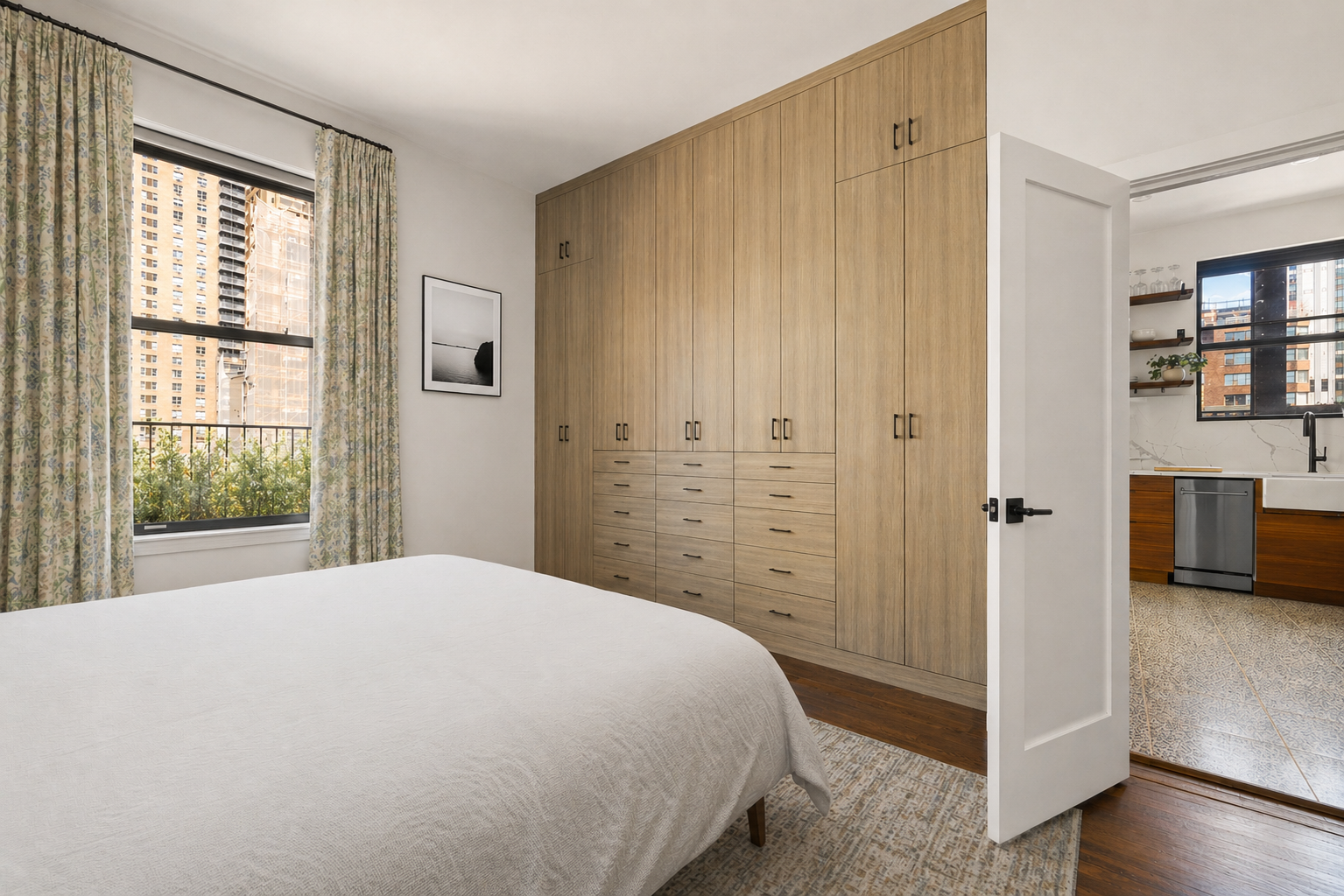 151 East 83rd Street, Unit PHC Manhattan, NY 10028 - Photo 11 of 16 a spacious bedroom with a bed and a window
