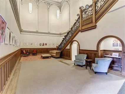 a view of hall way with furniture