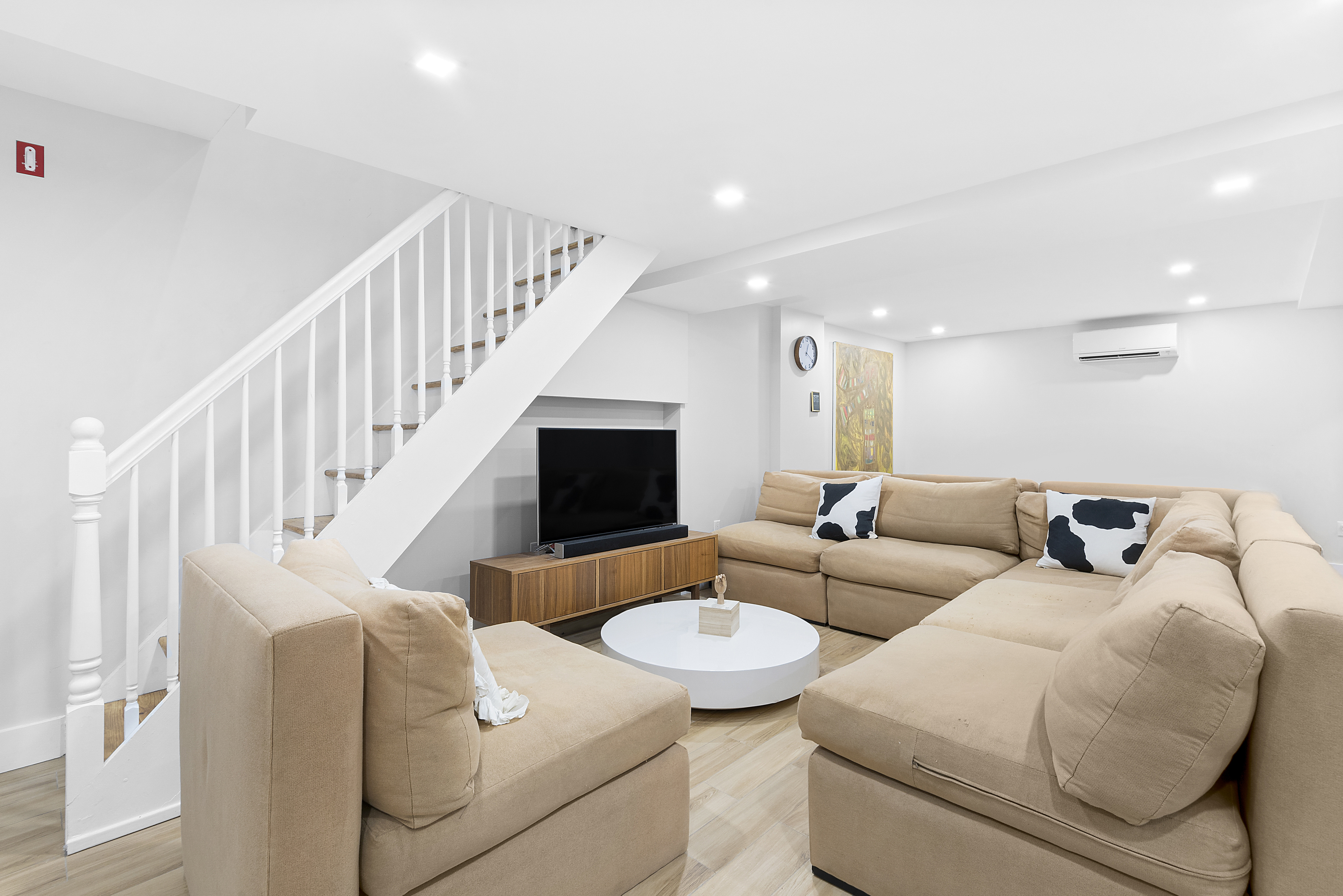 104 Dean Street, Unit 1R Brooklyn, NY 11201 - Photo 3 of 7 a living room with furniture kitchen view and a fireplace