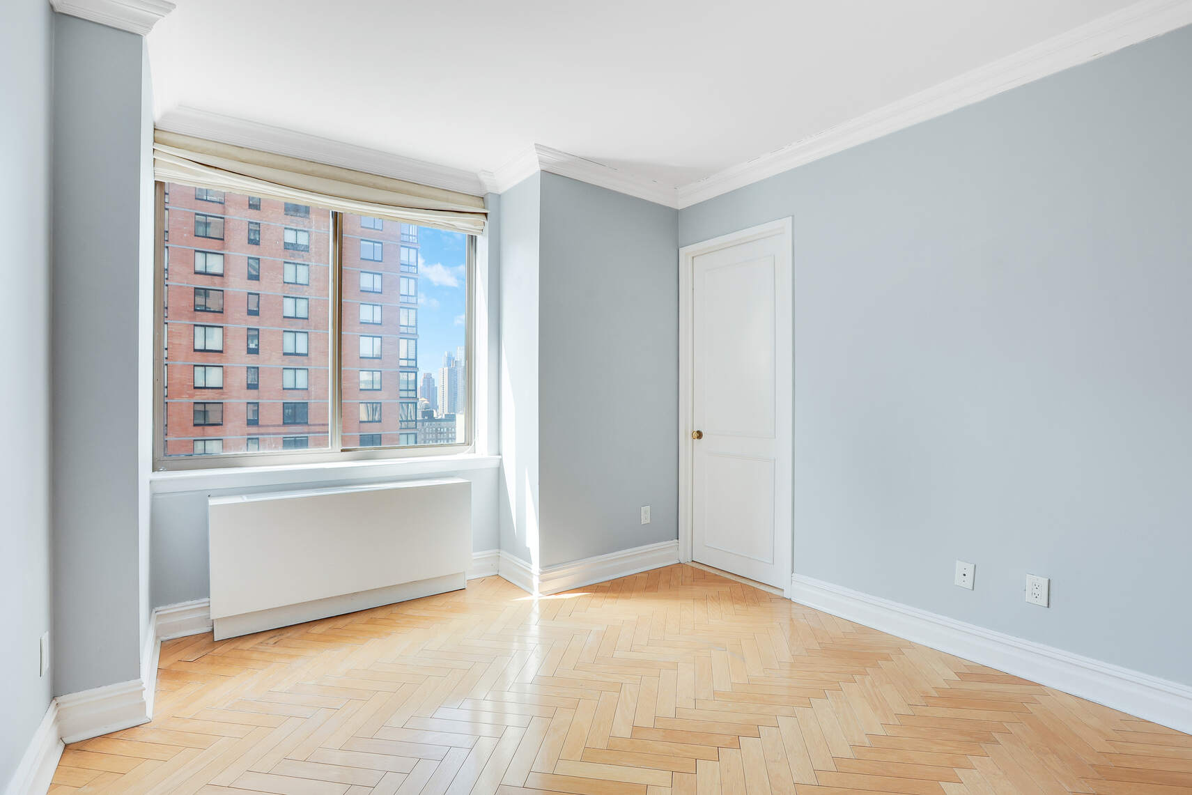 2 Columbus Avenue, Unit 17C Manhattan, NY 10023 - Photo 20 of 26 a view of an empty room with a window
