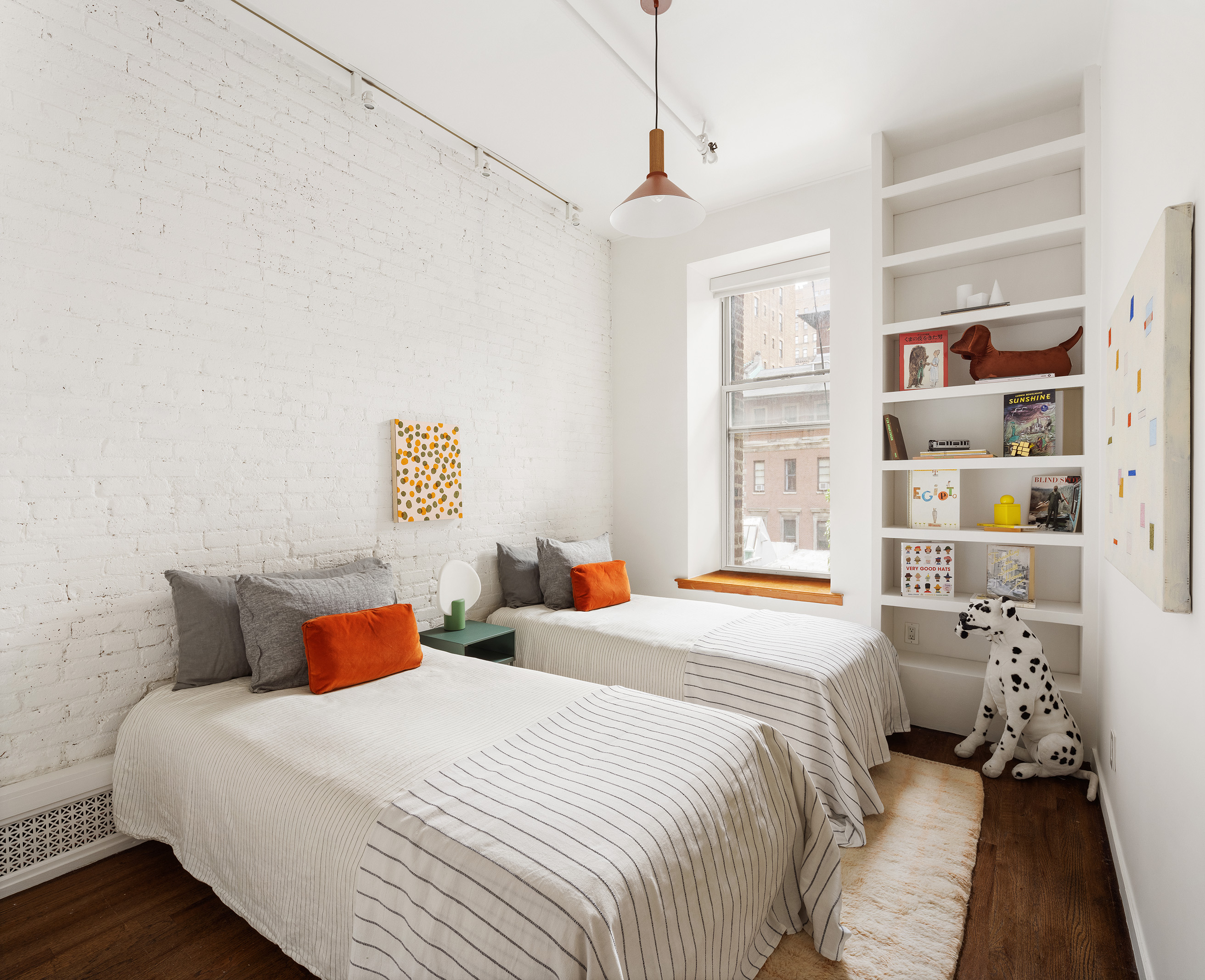 214 West 17th Street, Unit 4B Manhattan, NY 10011 - Photo 9 of 10 a bedroom with a bed and a window