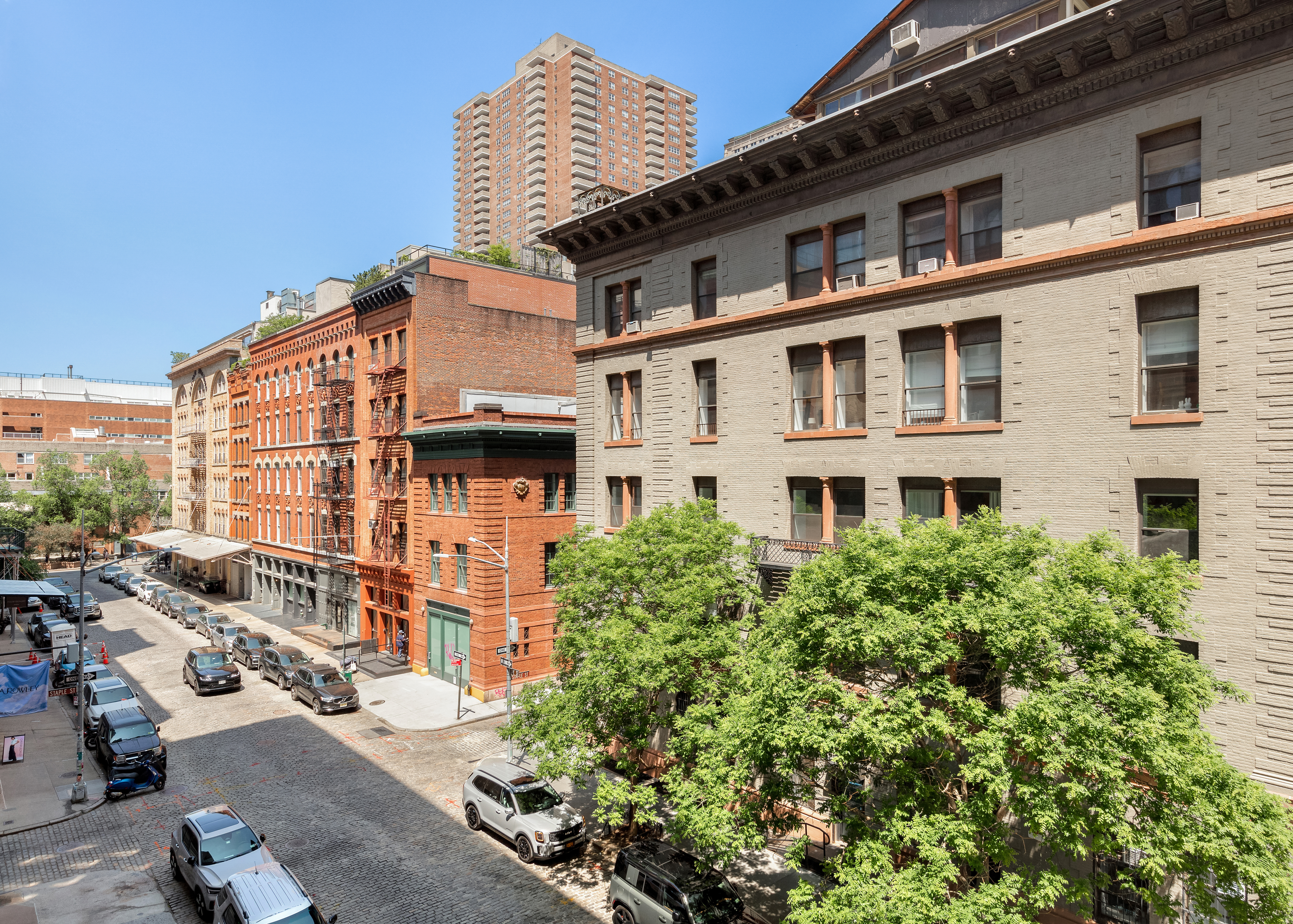 55 Hudson Street, Unit 3BCD Manhattan, NY 10013 - Photo 17 of 21 front view of a building with a garden