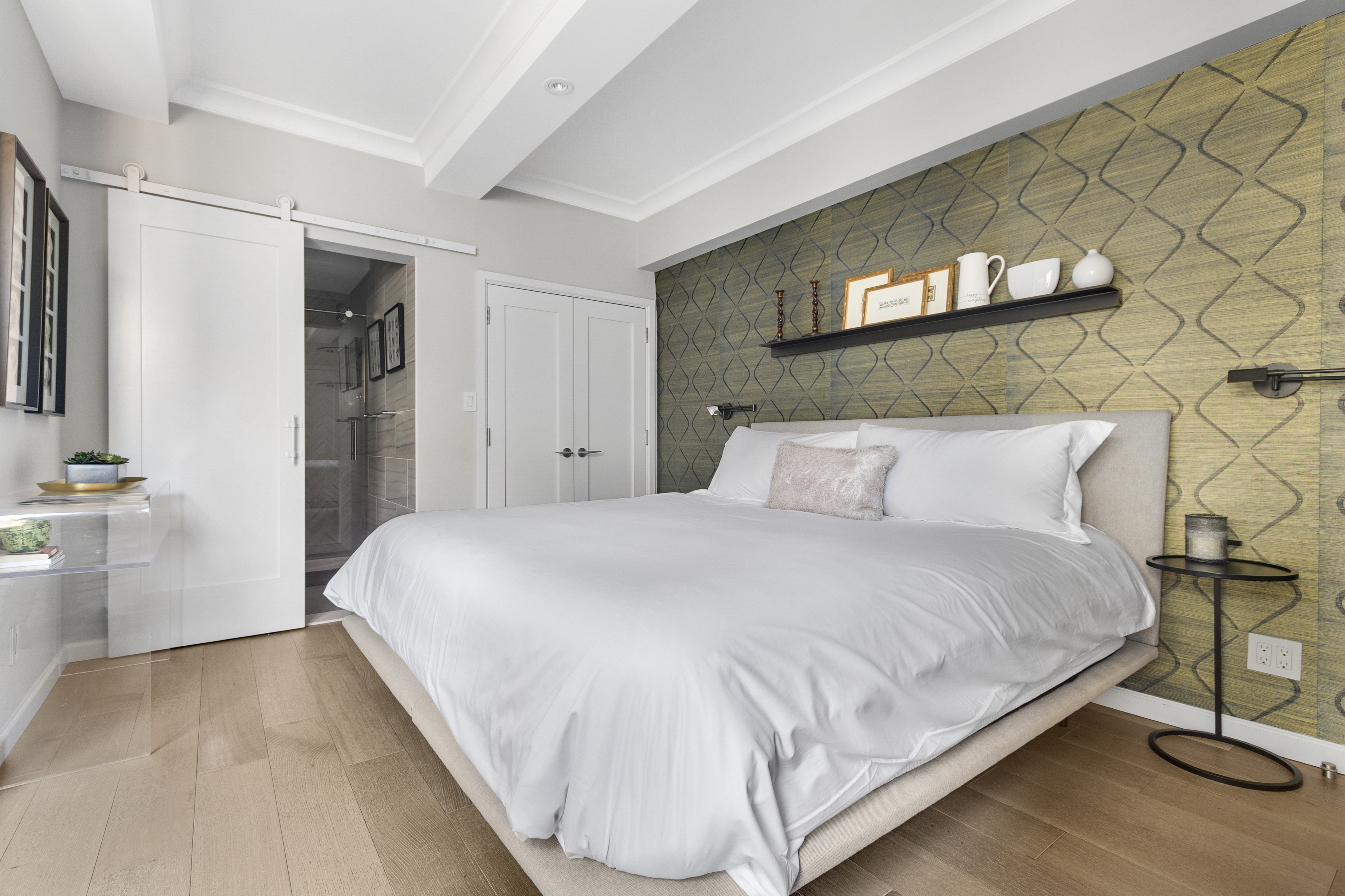 225 Central Park West, Unit 1516 Manhattan, NY 10024 - Photo 8 of 16 a large bed sitting in a bedroom and a table