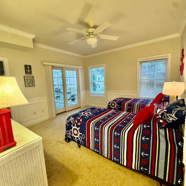a bathroom with a sink a toilet a mirror and shower