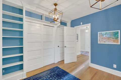 a bedroom with furniture and a window