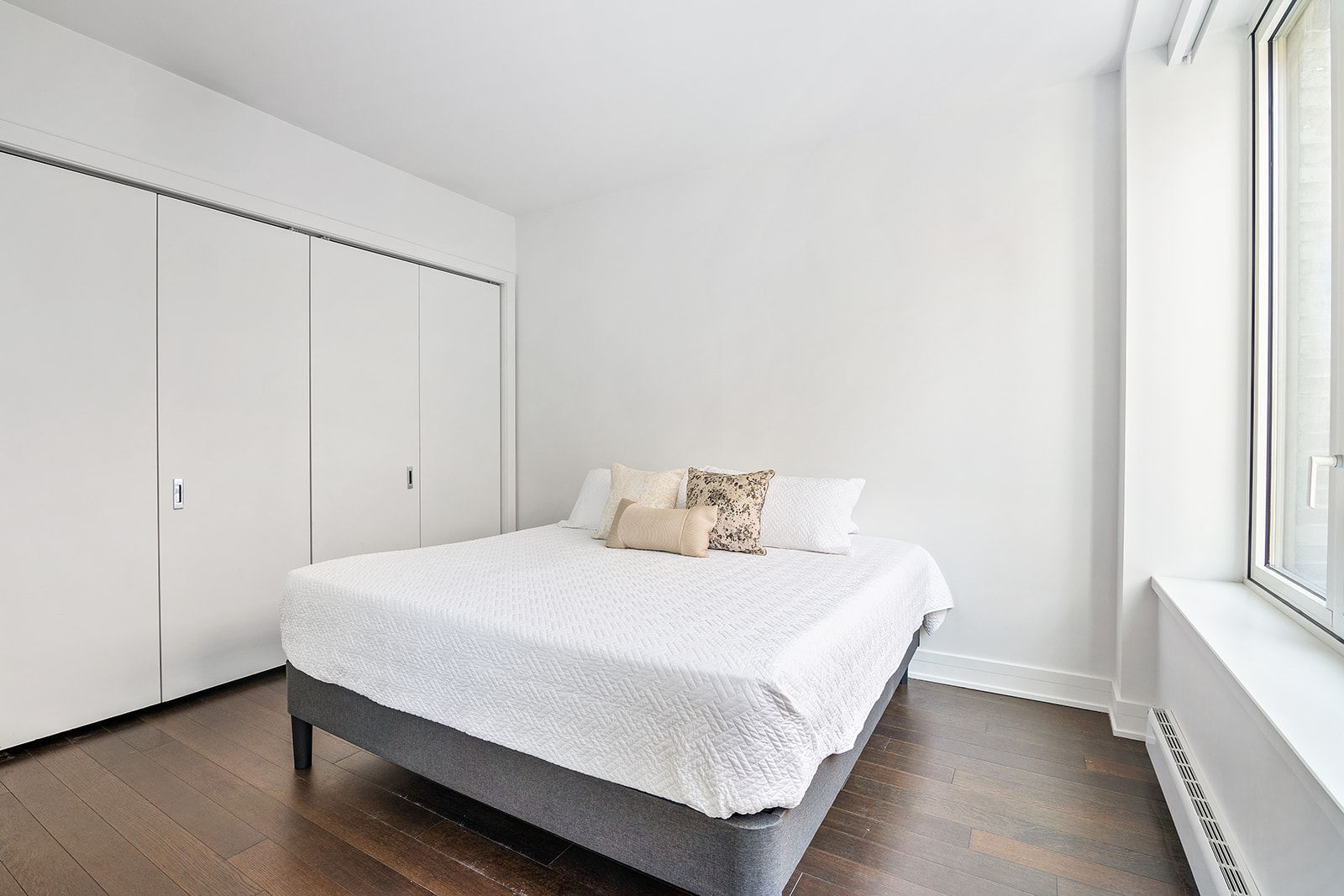 5 Franklin Place, Unit 14B Manhattan, NY 10013 - Photo 4 of 13 a bedroom with a bed and a window