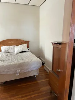 a kitchen with a table chairs and a refrigerator