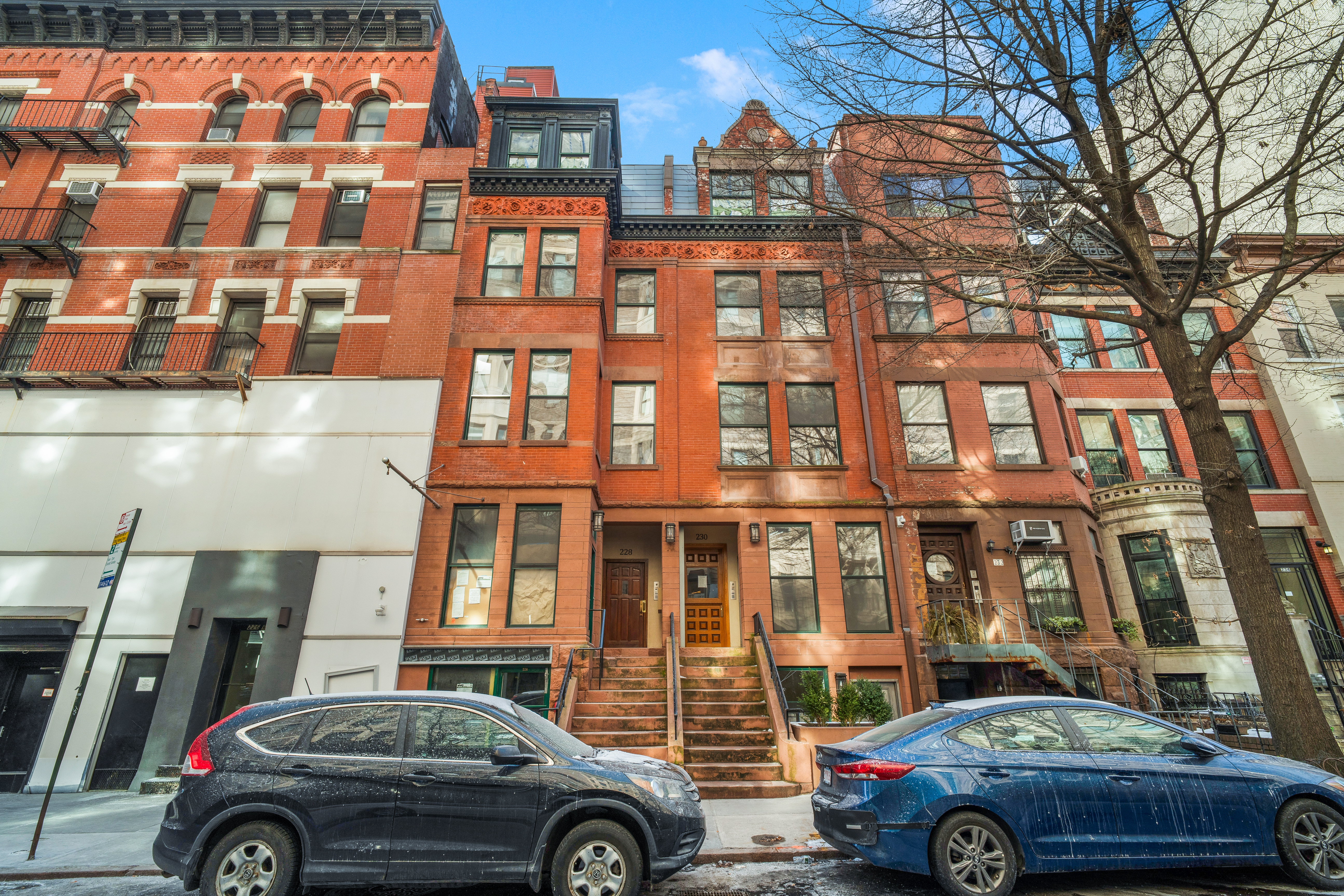 228 West 75th Street, Unit 4 Manhattan, NY 10023 - Photo 12 of 13 a front view of a residential apartment building with a parking space