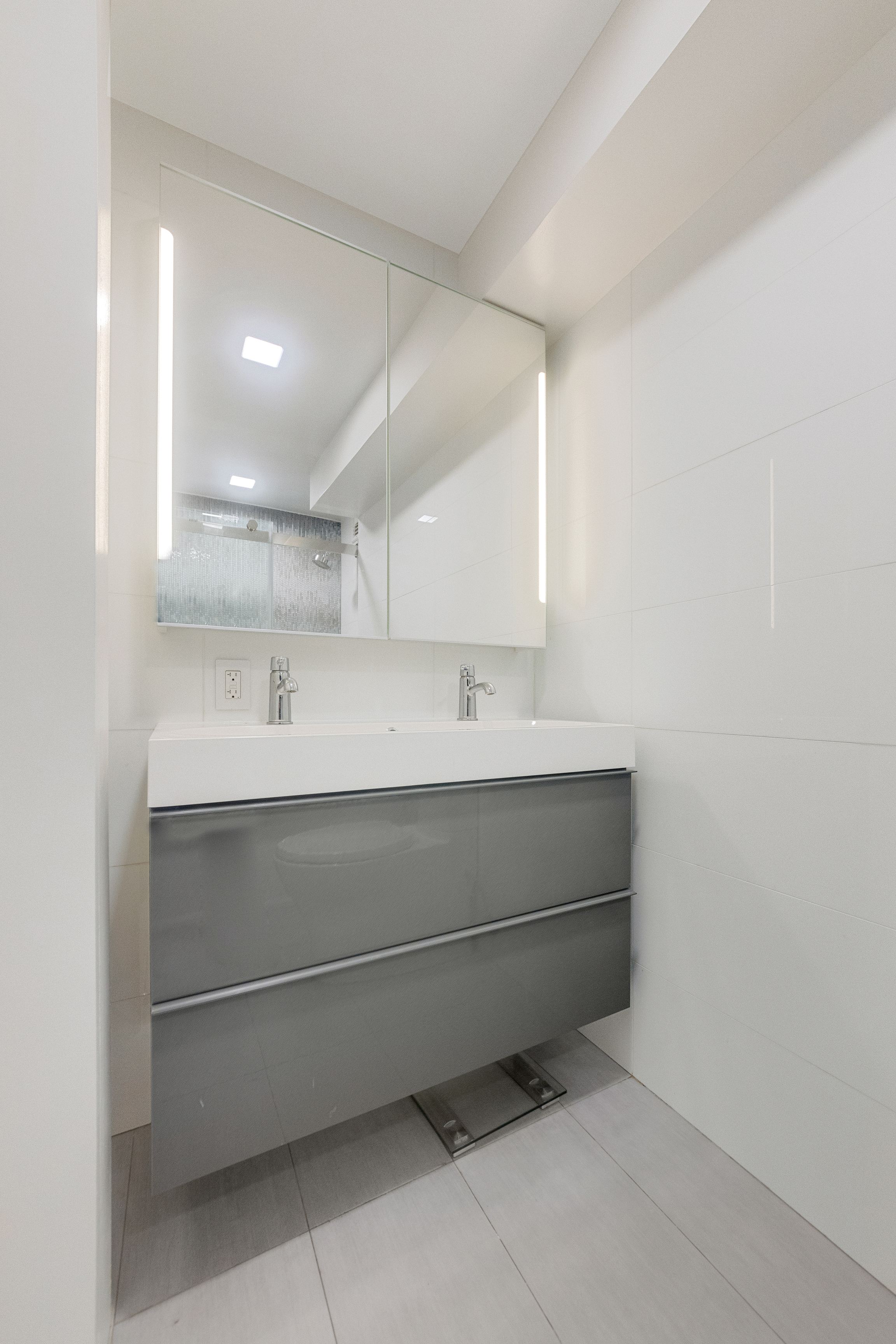 2 Tudor City Place, Unit 12DS Manhattan, NY 10017 - Photo 15 of 20 a bathroom with a sink and a mirror
