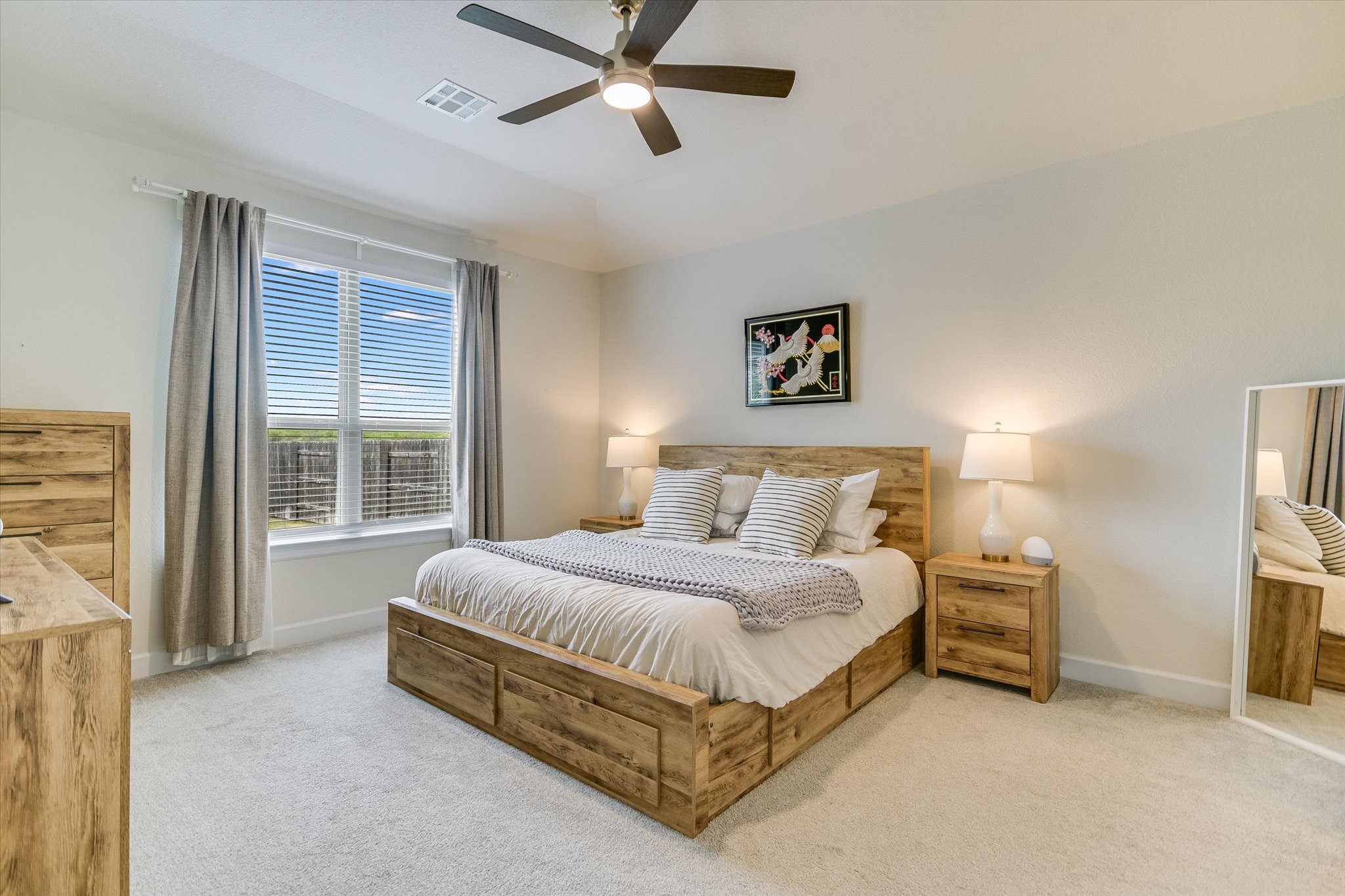 8607 McKamy Drive Austin, TX 78744 - Photo 9 of 28 a spacious bedroom with a bed and a window