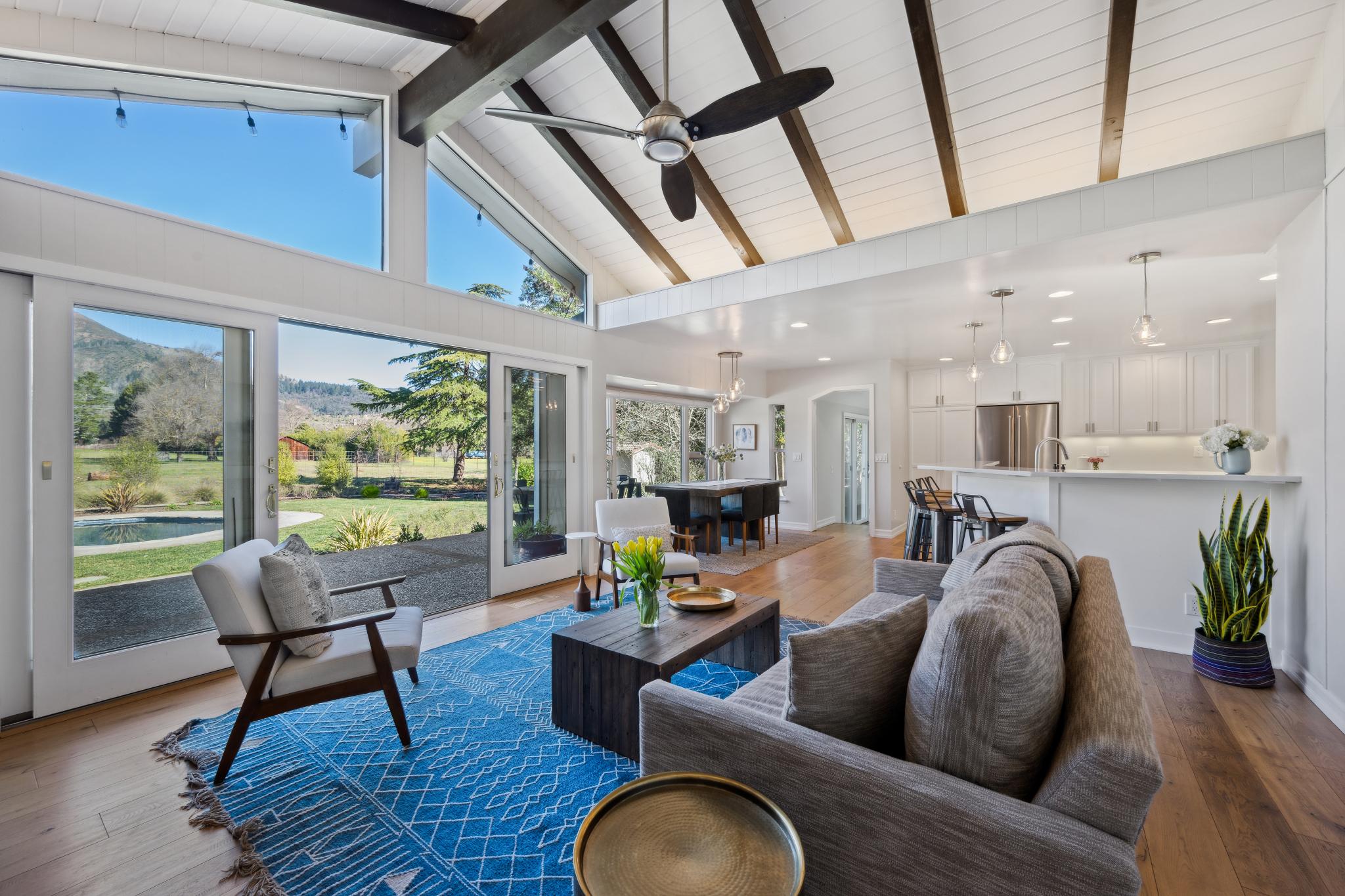 123 Frey Road Santa Rosa, CA 95409 - Photo 26 of 62 a living room with furniture a fireplace and a floor to ceiling window