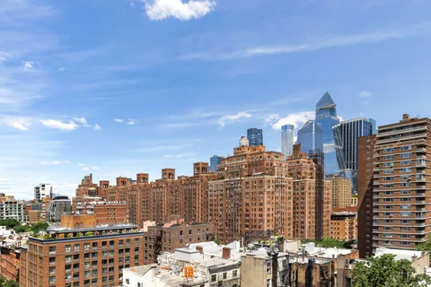 a view of a city with tall buildings