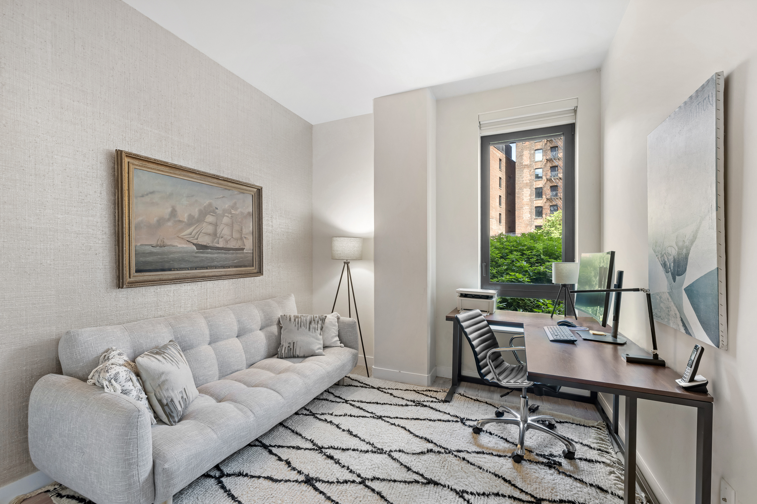 90 Furman Street, Unit N107 Brooklyn, NY 11201 - Photo 15 of 30 a living room with furniture a window and a flat screen tv