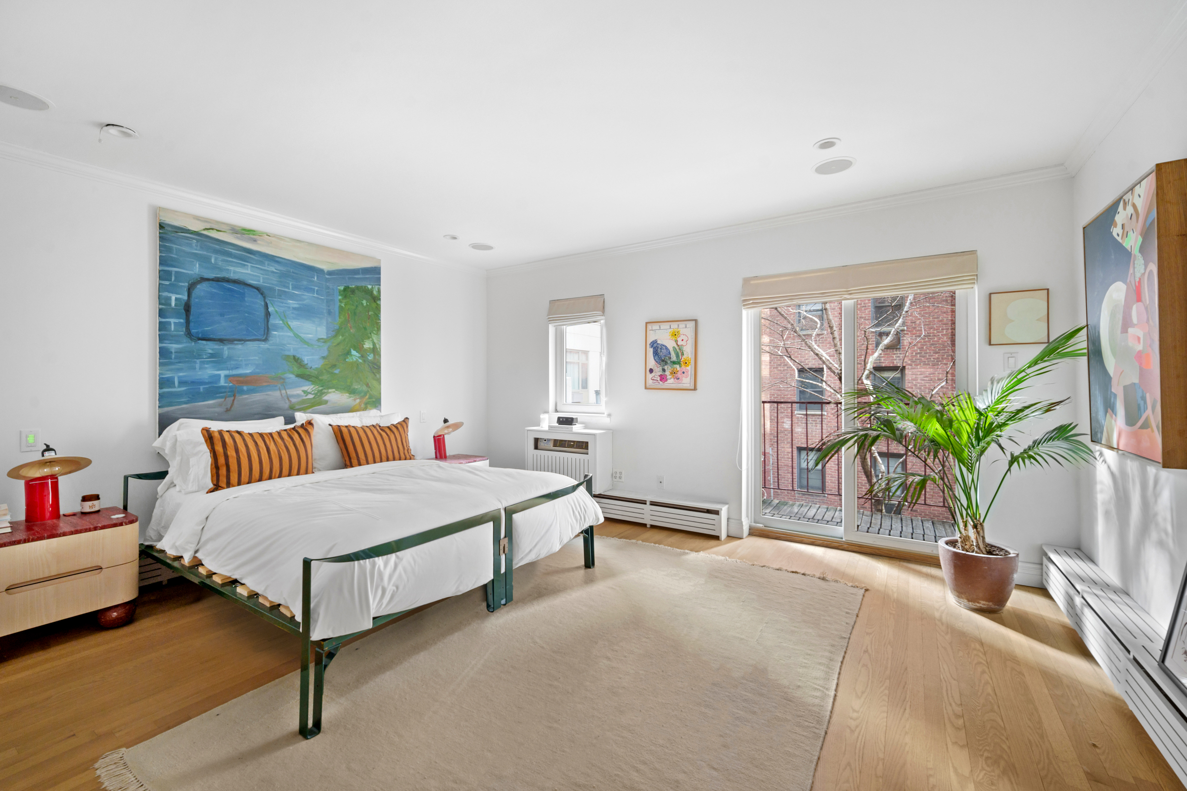 158 East 22nd Street, Unit 4 Manhattan, NY 10010 - Photo 9 of 15 a bedroom with a bed and a potted plant