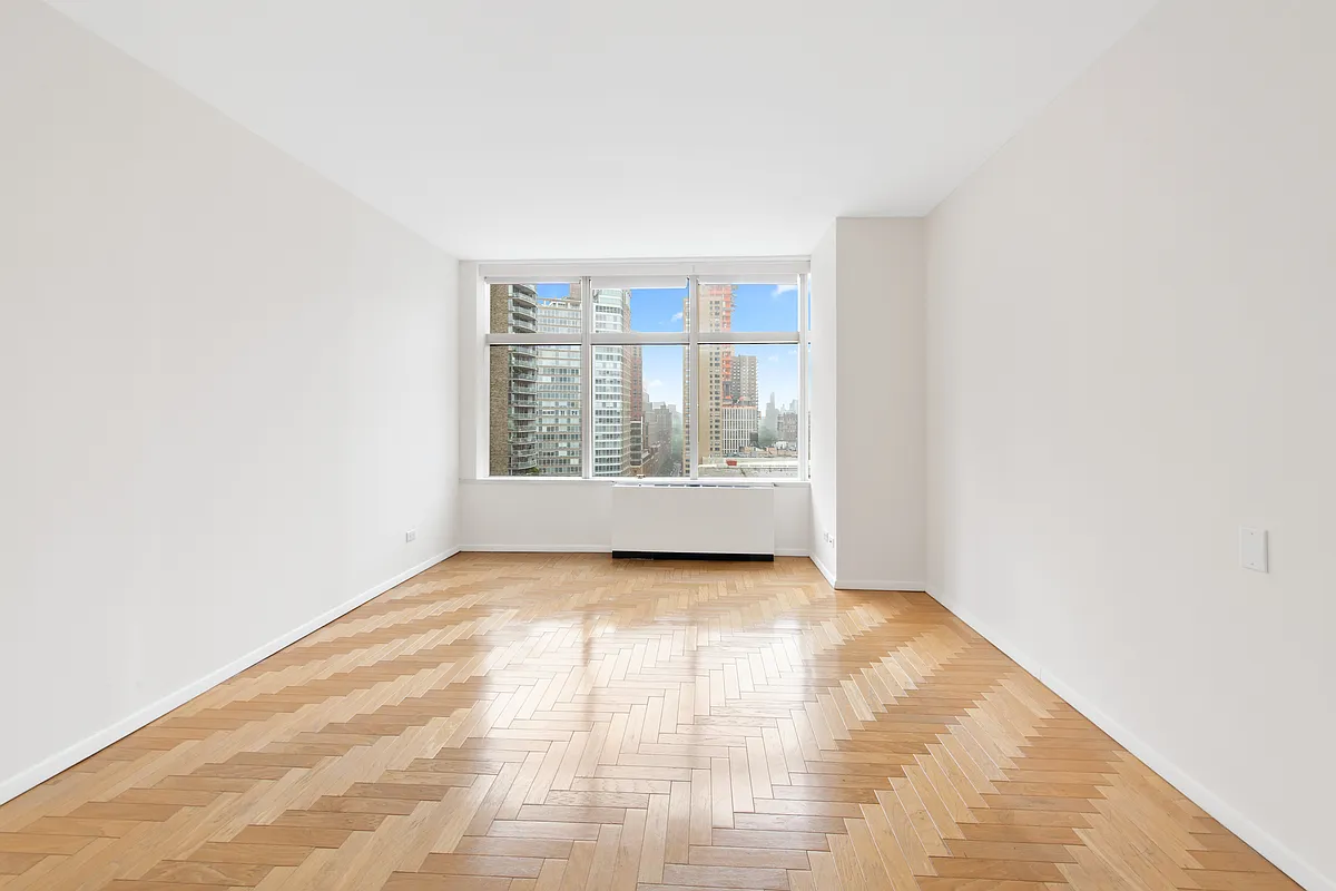 160 West 66th Street, Unit 17E Manhattan, NY 10023 - Photo 5 of 13 a view of an empty room with a window