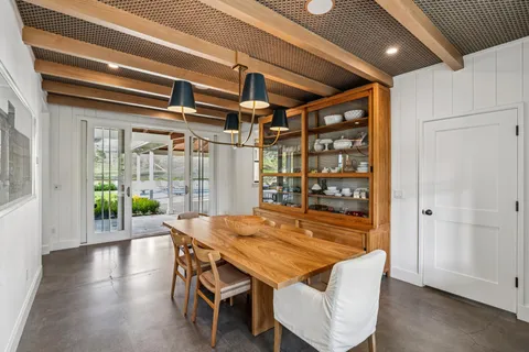 a dining room with wooden floor