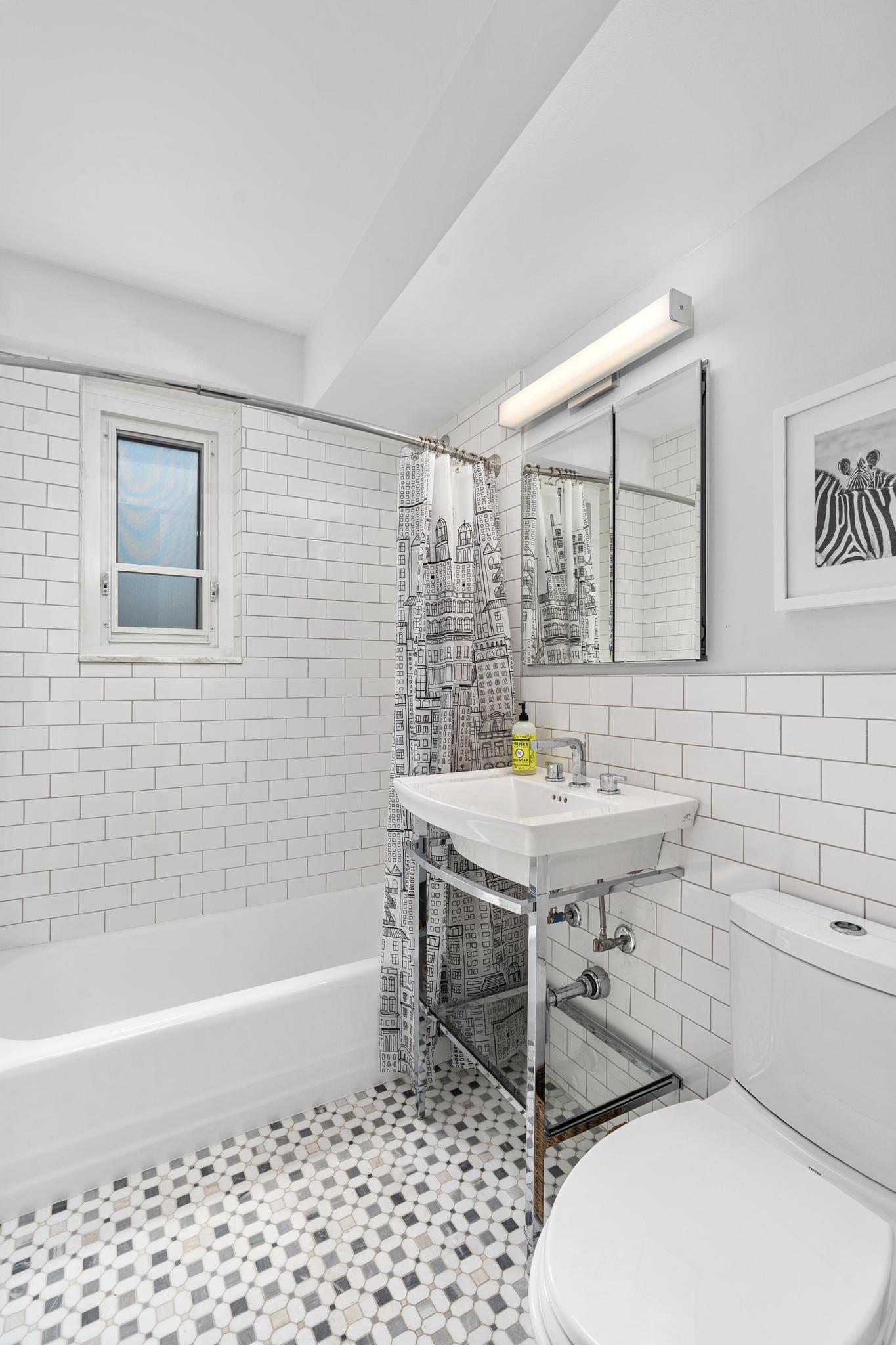 230 Jay Street, Unit 10H Brooklyn, NY 11201 - Photo 8 of 13 a bathroom with a sink a toilet and bathtub